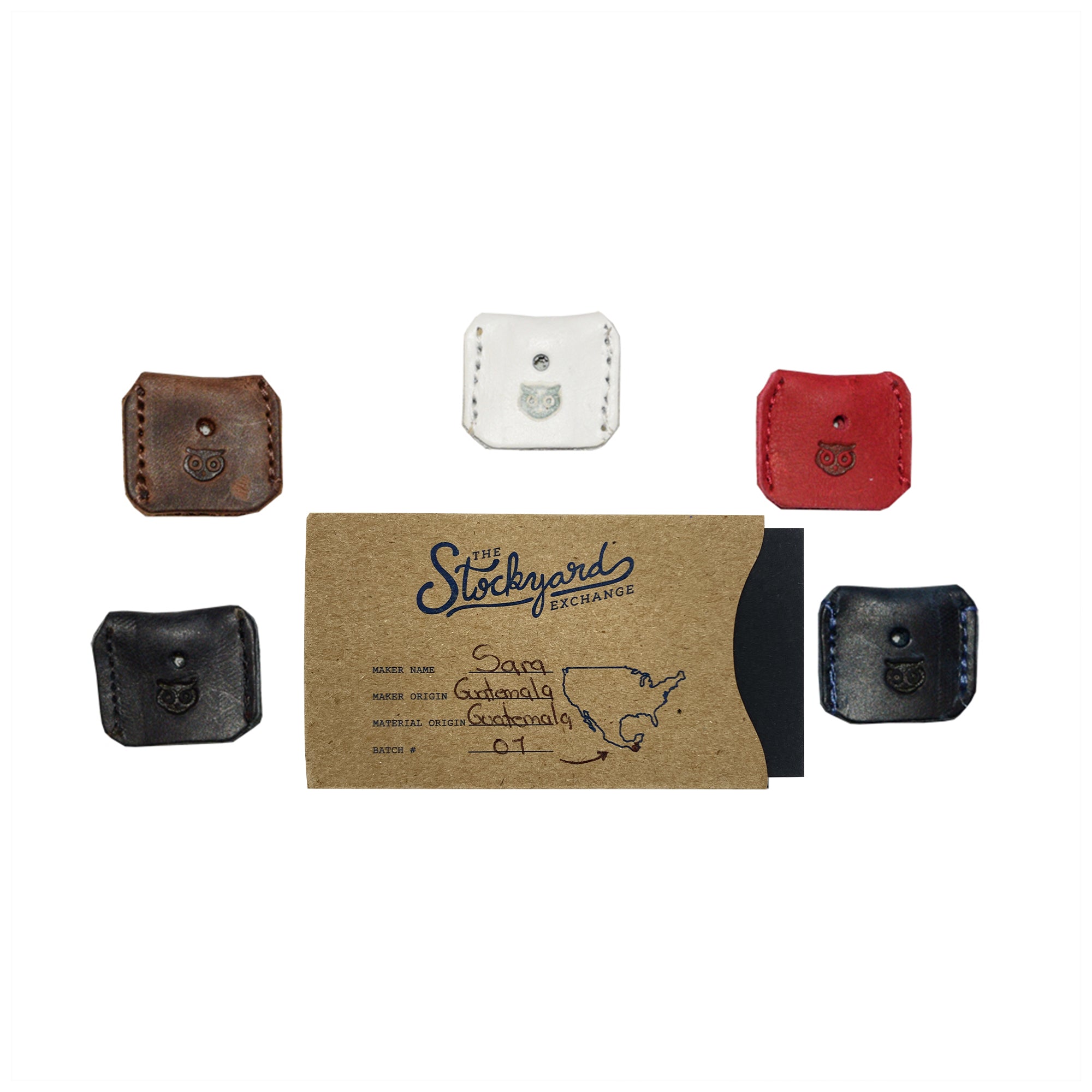 Artisan display of Key Covers from Hide & Drink on a rustic card. Each key protector demonstrates small batch production techniques like hand cut and hand sewn methods using premium full grain leather, reflecting a handmade quality from La Antigua Guatemala & Oaxaca Mexico.