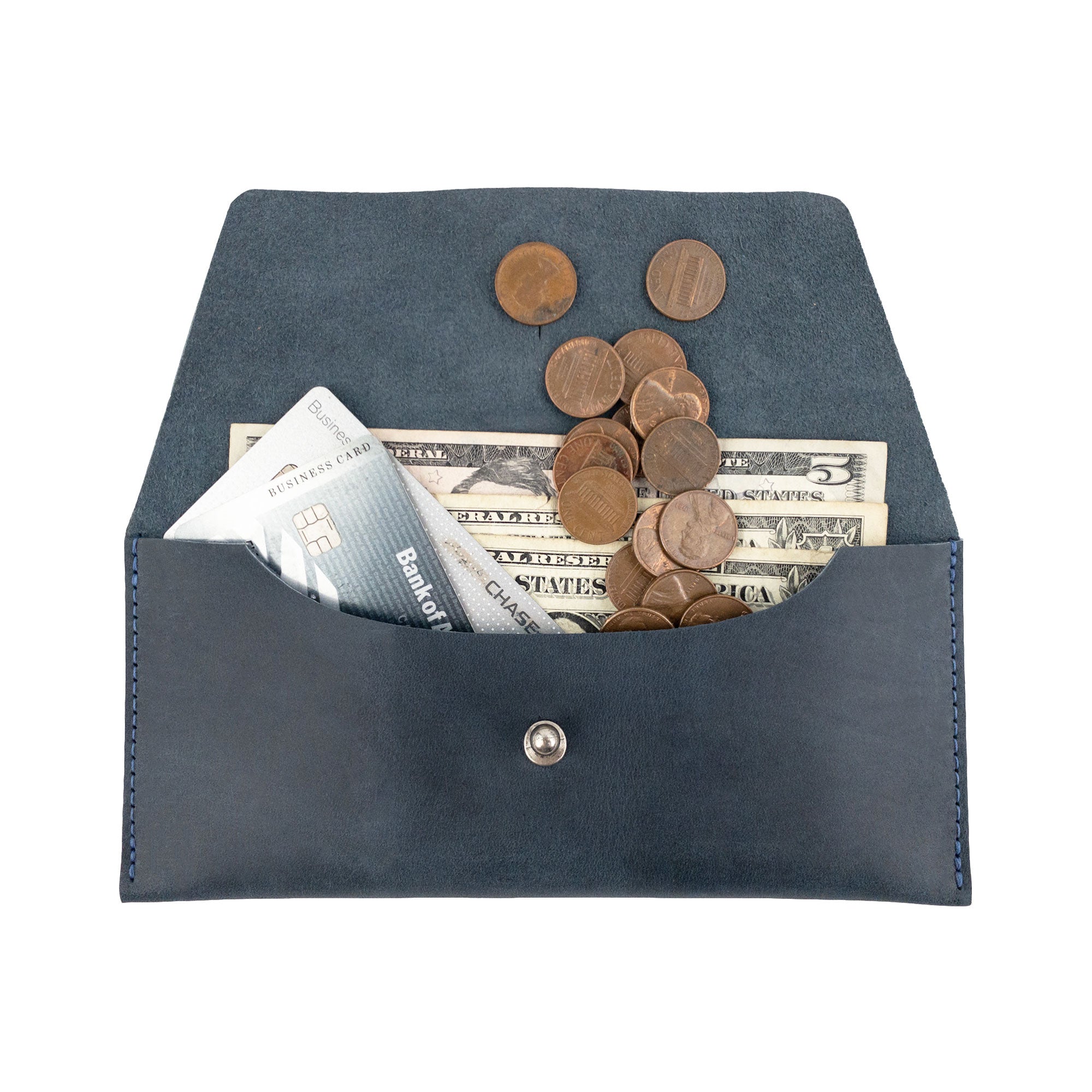 The Long Utility Pouch by Hide & Drink filled with cash and coins, showcasing its practicality and stylish nature for easy organization.