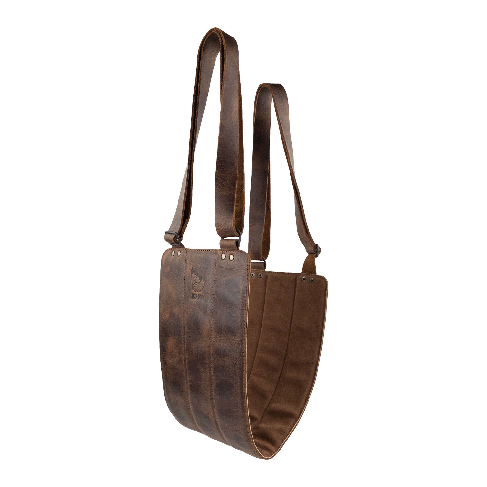 Unique presentation of the Rustic Dog Lift Harness by Taco Dog, emphasizing its practicality and style. Made from Full Grain Leather, this handmade support belt helps pets in rehabilitation, ensuring they feel supported during their recovery. Each harness is crafted with care and attention to detail by artisans, reflecting dedication in small batch production in La Antigua Guatemala & Oaxaca Mexico.
