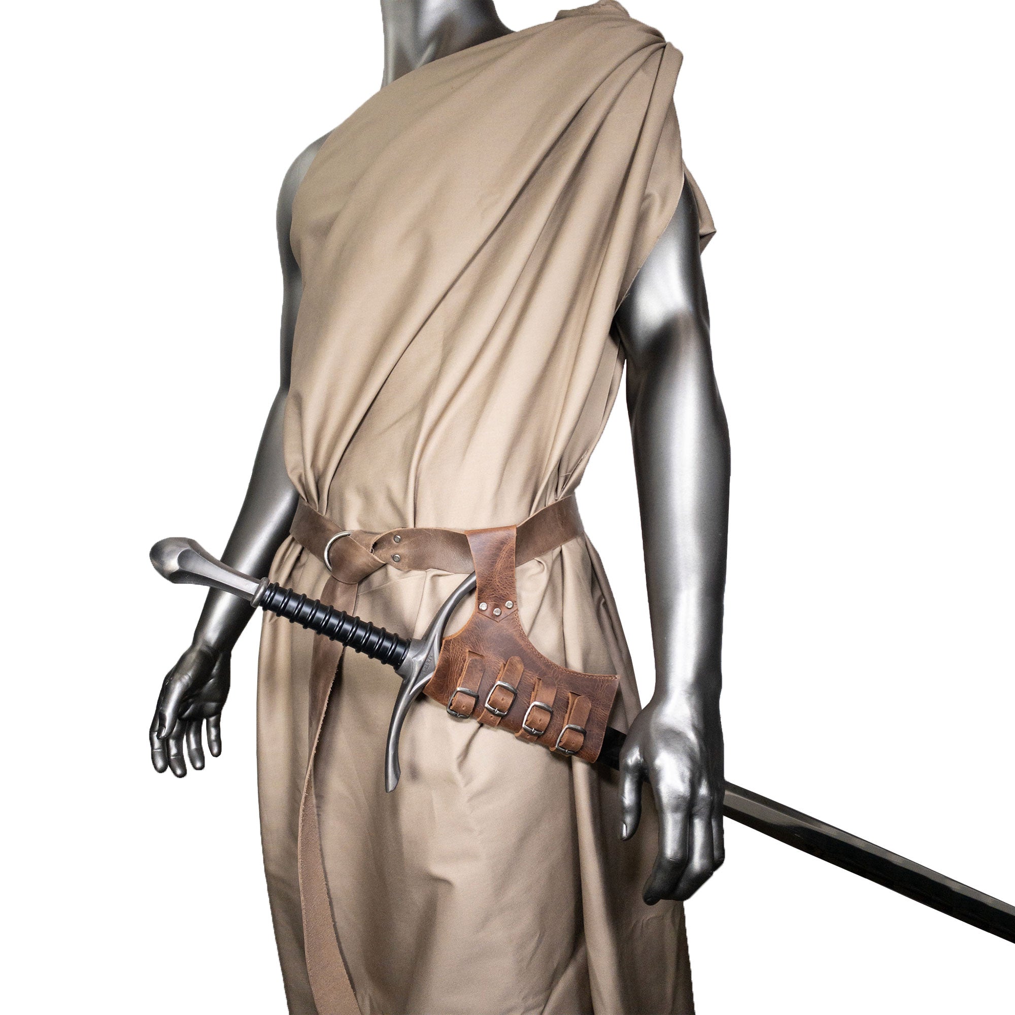 Another angle of the mannequin showcasing the Sword Frog Leather Holder by Hide & Play, reinforcing its blend of functionality and design for medieval costumes. This holder, made from full grain leather, highlights the commitment to small batch production and artisan craftsmanship in La Antigua Guatemala & Oaxaca Mexico.