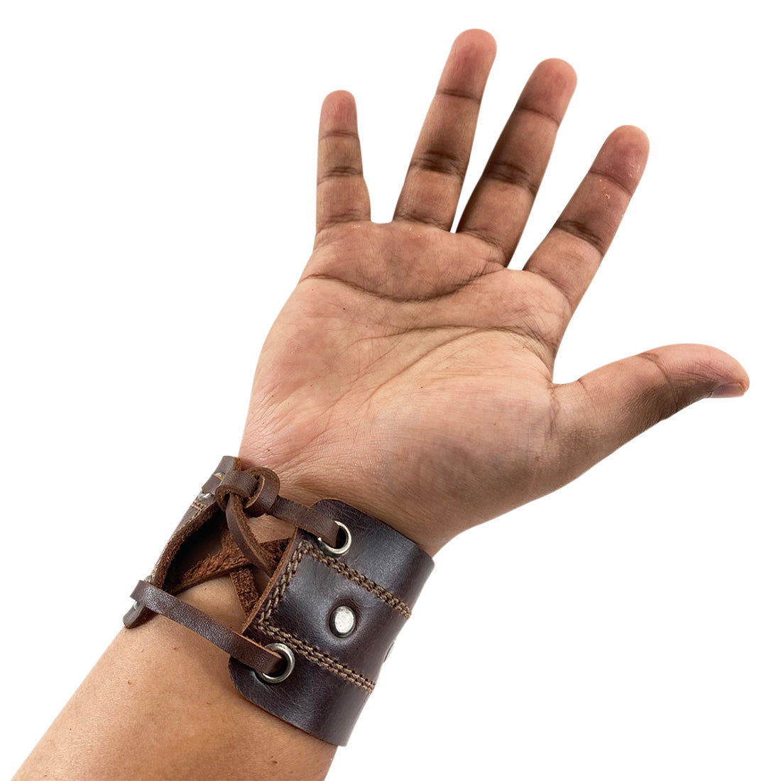 A hands-on view of the Men's Wristband by Hide & Drink, featuring its robust structure and fine craftsmanship. This handmade wristband delivers a rock 'n roll style while representing the dedication of artisans in leather goods production. Men's Wristband Handmade, Full Grain Leather, StockyardX, Small Batch Production, Hand Cut, Hand Sewn, Fire Branded, Artisan, Handmade in La Antigua Guatemala & Oaxaca Mexico.