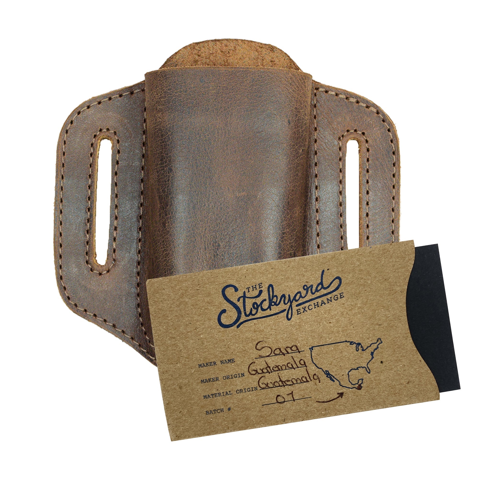 Hide & Drink Multitool Belt Sheath alongside a handcrafted label showing its artisan origin. This unique item serves as a tool holster for waist, made from soft full grain leather, perfect for users looking for outdoor accessories that are stylish and practical.