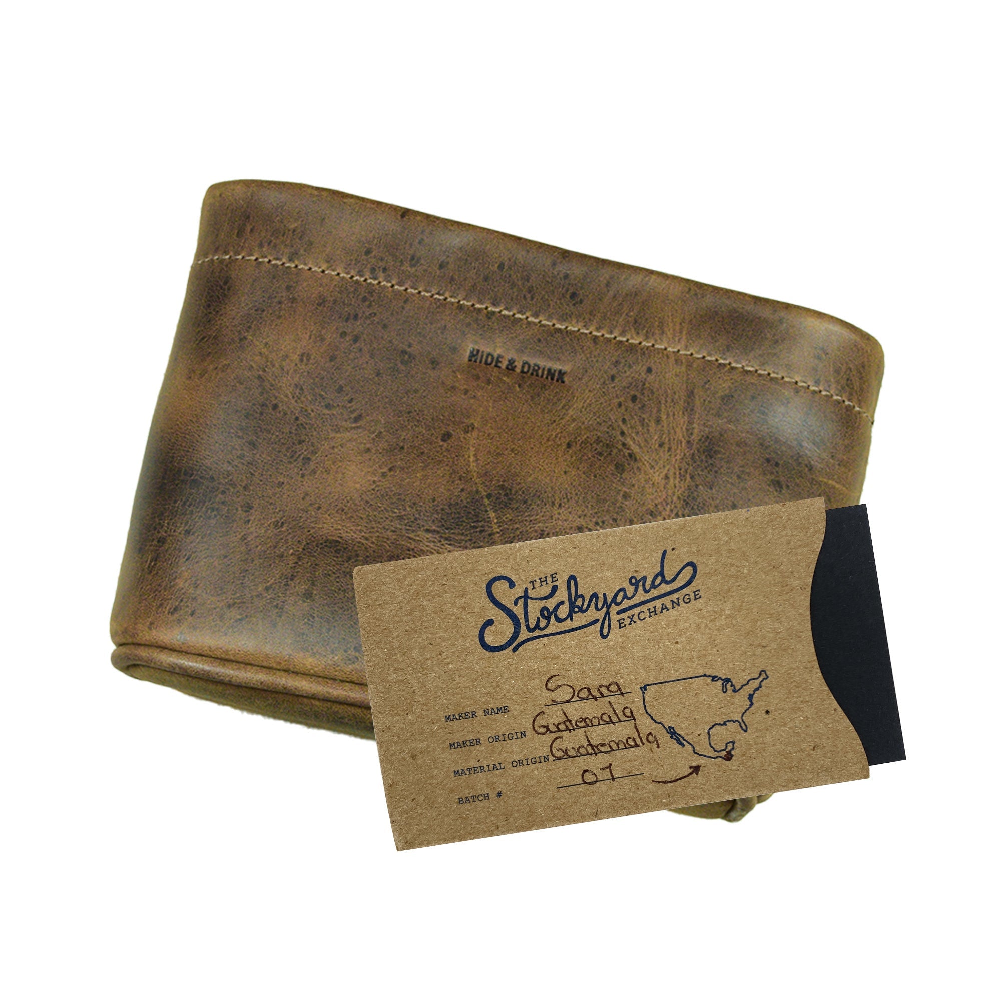 The Hide & Drink Desk Organizer Bag with attached tag, showing artisanal details. Made from durable Full Grain Leather, this handmade accessory not only organizes pens but also reflects small batch production crafted in La Antigua Guatemala & Oaxaca Mexico.