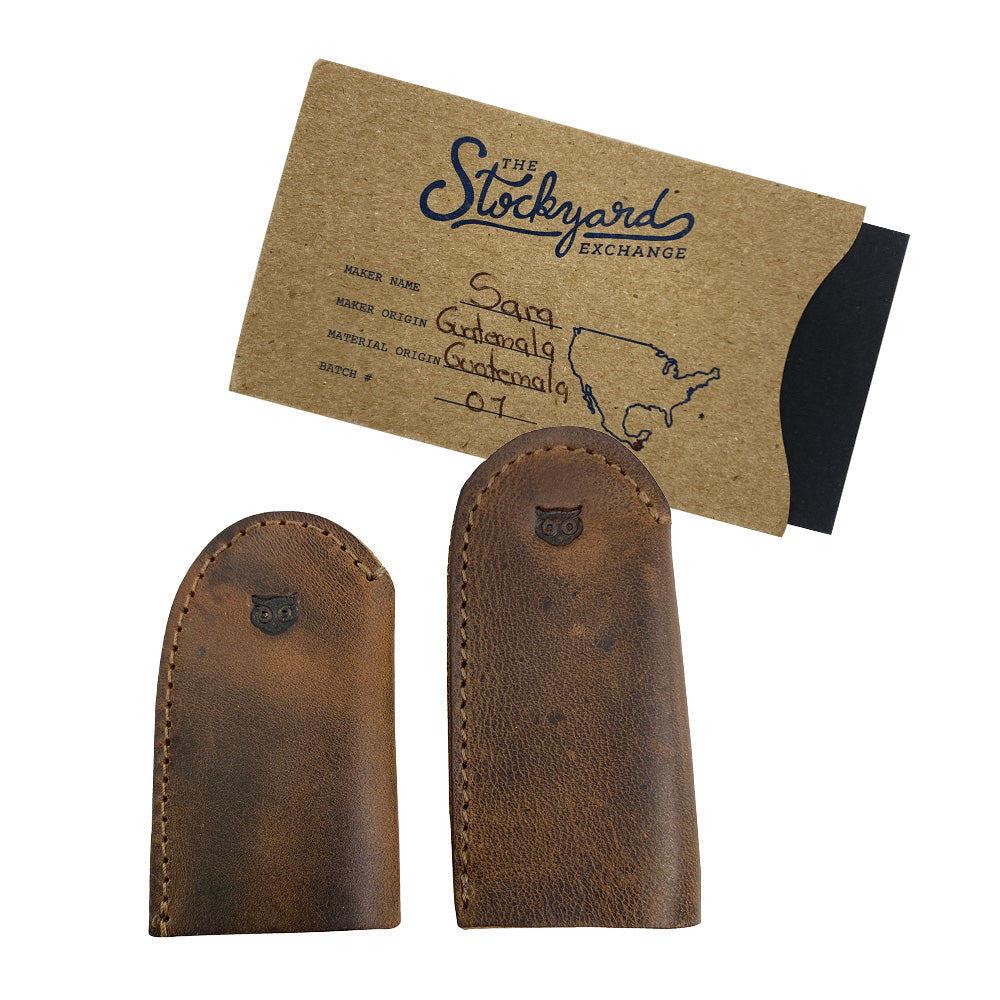 Leather Thimble for Thumb & Index Finger (3 Paires) by Hide & Drink featuring dimensions of two thimbles from the set of 3 pairs (6 pieces). Ideal for finger protection in sewing, hand appliqué, EPP, and quilting, these thimbles are made from premium full grain leather. StockyardX emphasizes the artisan, handmade quality of these thimbles, hand cut and hand sewn, with fire branded detailing, crafted in La Antigua Guatemala & Oaxaca Mexico.