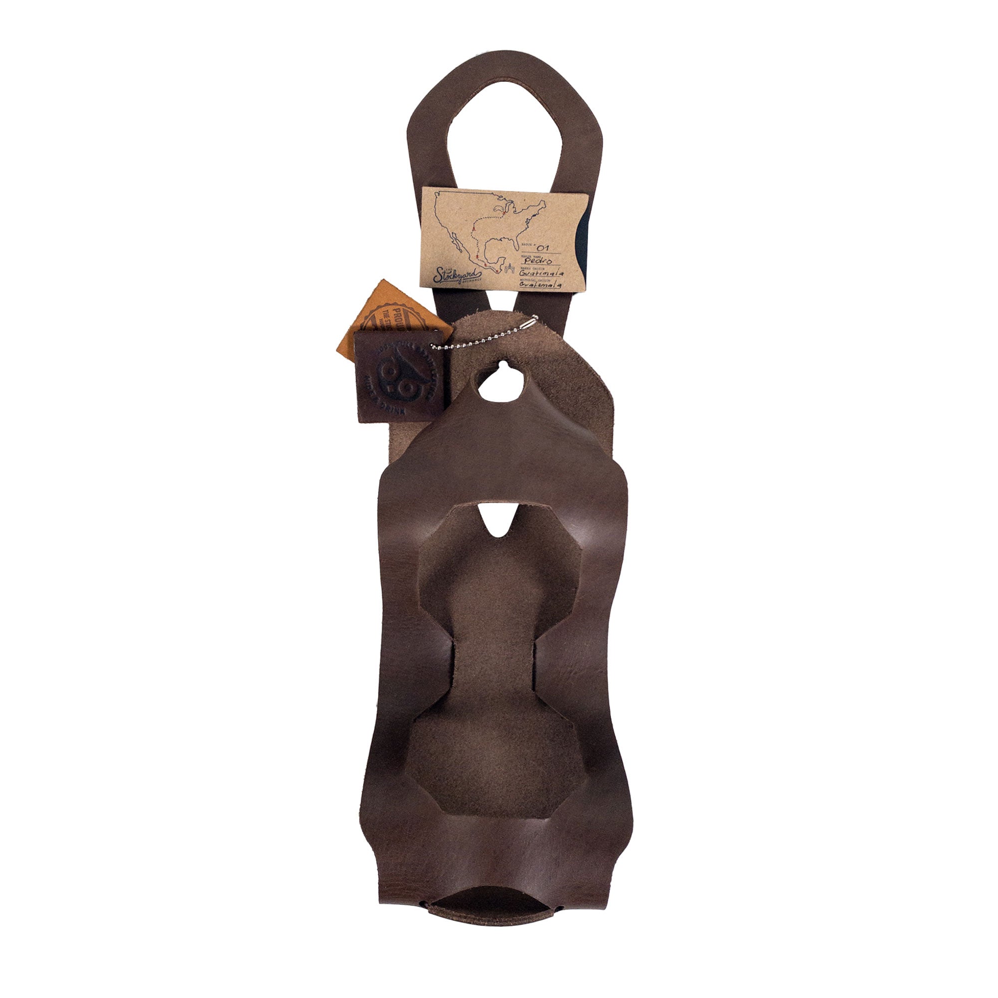 The Unibody Bike Wine Carrier from Hide & Drink, showcasing packaging and branding details, and made from Full Grain Leather. An artisan product, emphasizing small batch production and skilled craftsmanship from La Antigua Guatemala & Oaxaca Mexico.
