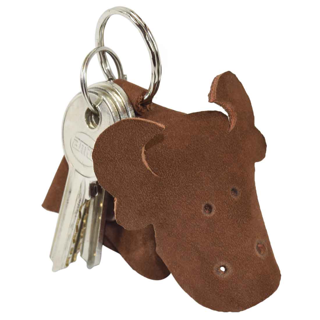 Charming Full Grain Leather Animal Key Chain from Hide & Drink, featuring a delightful cow design. This attractive Critter Keychain serves as a unique fob charm and an animal key holder charm pendant, highlighting artisan quality through its small batch production in La Antigua Guatemala.