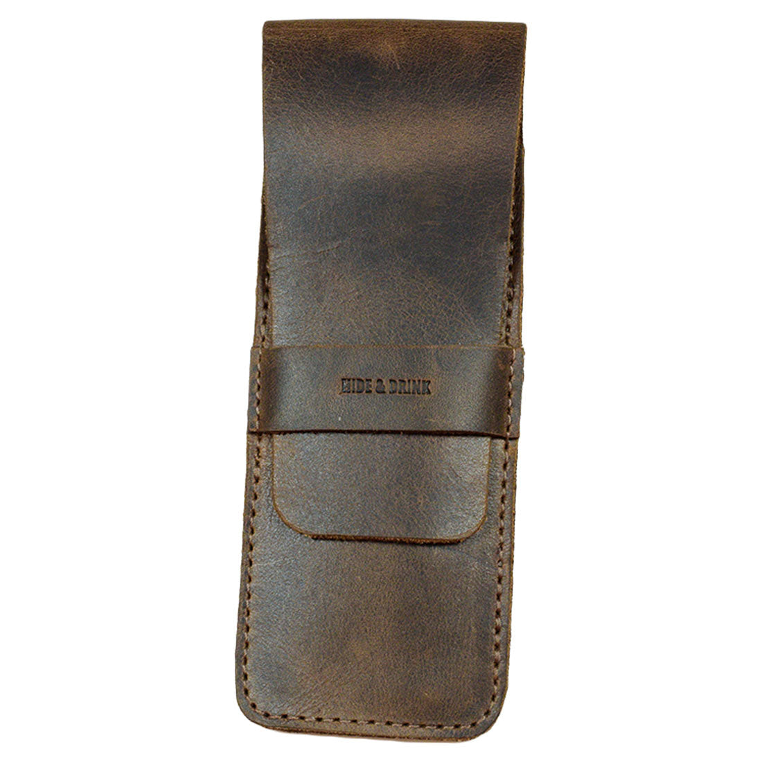 A top-down view of the Hide & Drink Pen Case, highlighting its elegant and practical design. As a functional Pen Case Holder, it doubles as a Multi Pen Pouch that stores various writing tools. Made from premium Full Grain Leather, it reflects StockyardX's focus on small batch production. The artisanal quality is evident in the hand cut and hand sewn craftsmanship, marked by the fire branded logo, handmade in La Antigua Guatemala & Oaxaca Mexico.