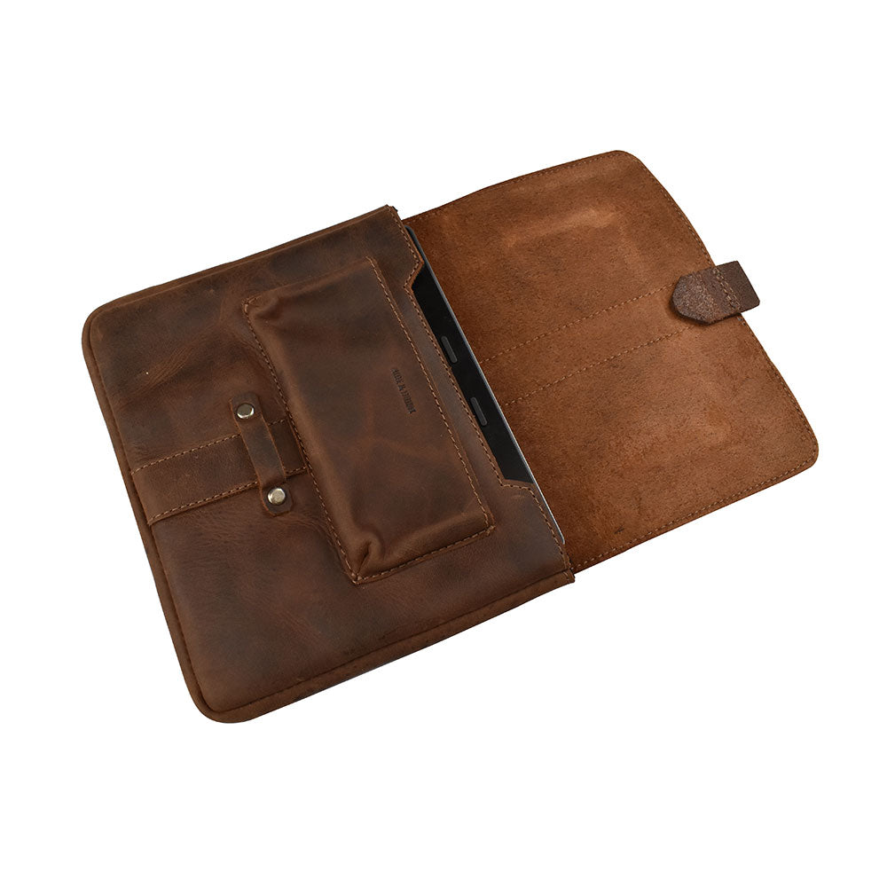 Inside view of the Kindle Oasis Sleeve by Hide & Drink, displaying a compact slot for essentials. This stylish Full Grain Leather Tablet Sleeve doubles as a Protector Cover, making it a must-have travel accessory, expertly hand cut and hand sewn.