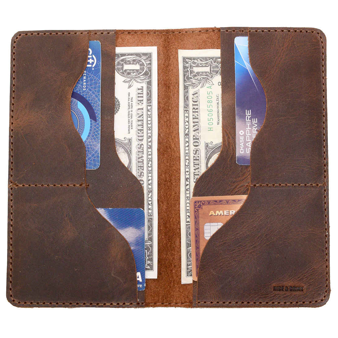 Hide & Drink Large Organizer Wallet open to reveal multiple card slots and a flat money holder. Crafted from premium full grain leather, this handmade travel accessory is a great choice for those who appreciate artisan, unique craftsmanship from La Antigua Guatemala & Oaxaca Mexico.