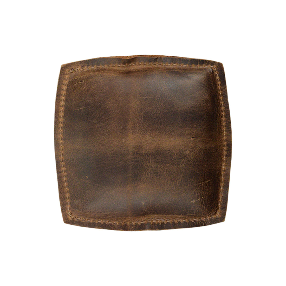Detailed image of the Forearm Cushion by Hide & Drink, featuring rich full grain leather. Ideal as a mouse support accessory, this handmade wrist rest pad is the result of small batch production, highlighting hand cut and sewn techniques by artisans in La Antigua Guatemala & Oaxaca Mexico.