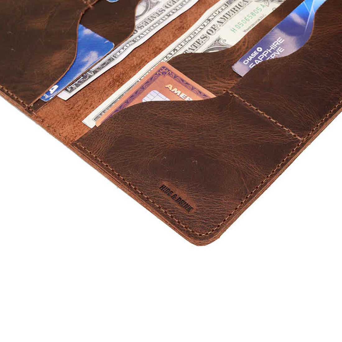 Hide & Drink Large Organizer Wallet with a focus on its card slots and cash holding features. This handcrafted bifold wallet, made from high-quality full grain leather, is a perfect travel accessory and highlights artisan craftsmanship from La Antigua Guatemala & Oaxaca Mexico.