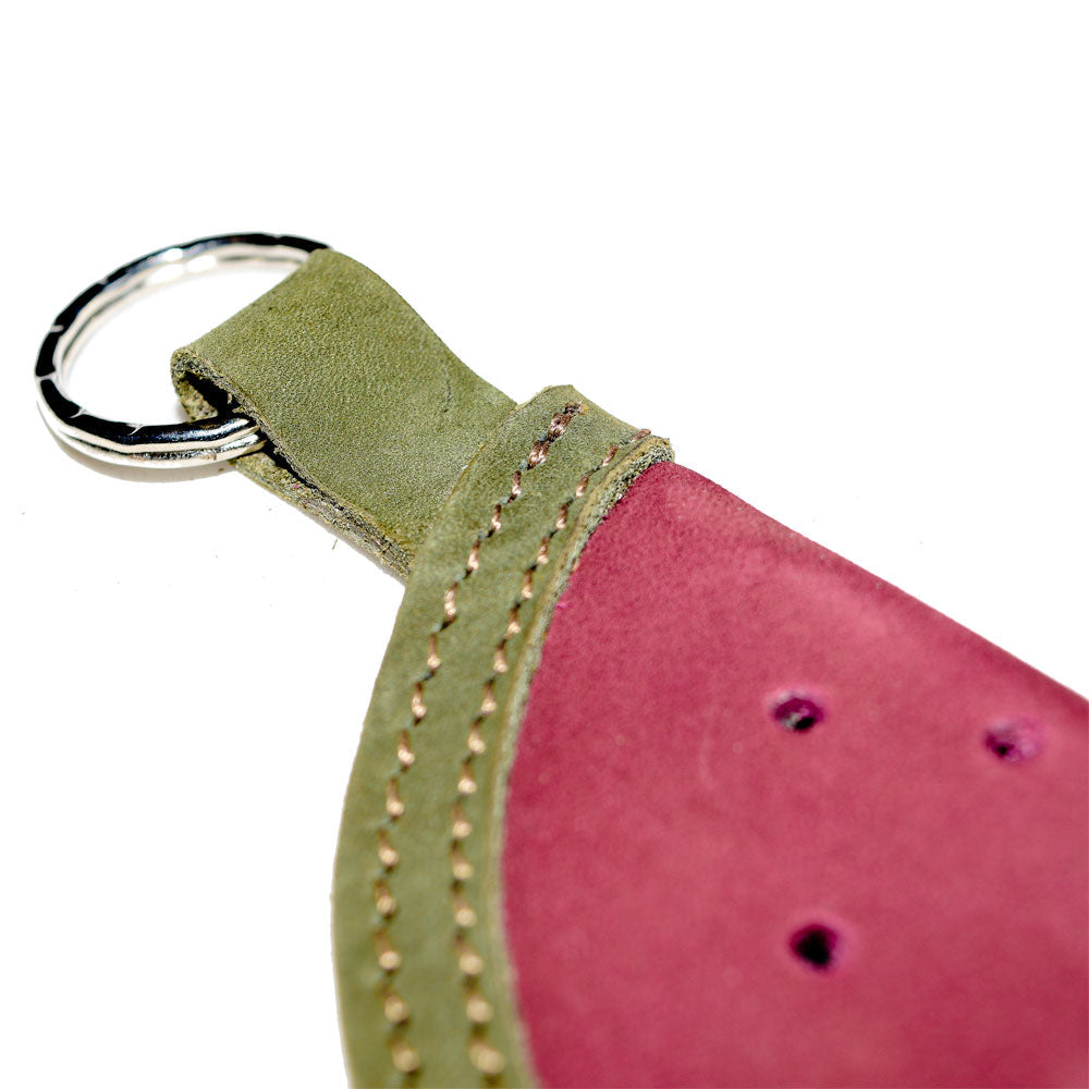 A close-up view of the Watermelon Keychain by Hide & Drink, focusing on the fine stitching that adds character to this cute fruit-themed key holder. Made from exquisite full grain leather through handmade small batch processes, it's a statement piece that reflects artisan quality from La Antigua Guatemala & Oaxaca, Mexico.