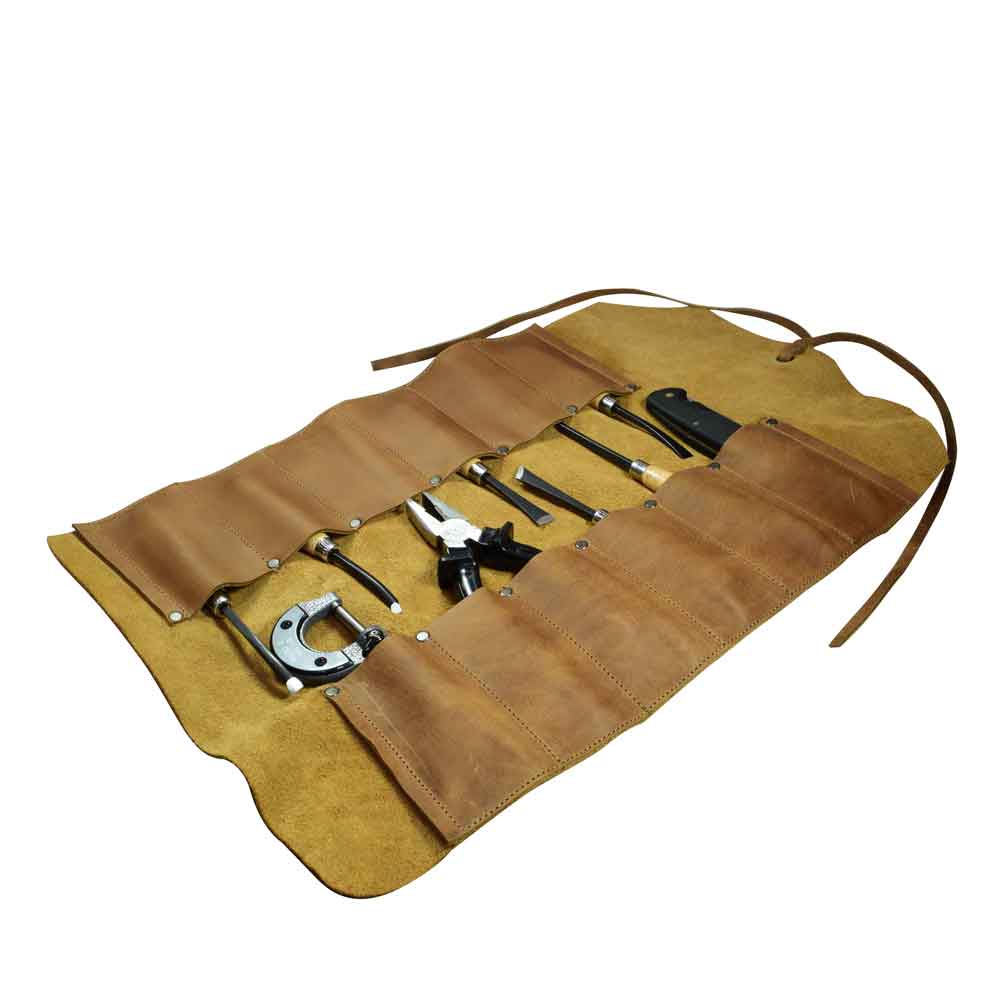 Hide & Drink Tool Roll (12 Pockets): The tool roll displayed in a relaxed state, offering a blend of style and utility for on-the-go tool storage. Tool Bag Roll Up, 12 Slot Heavy Duty Tool Roll Bag Organizer, Tool Roll Up Bag, Portable Tool Wrap Roll Bags for Travel, Durable Tool Kit Folding Tool Pouch Roll Up Mechanic Gifts for Men, Full Grain Leather, StockyardX, Small Batch Production, Hand Cut, Hand Sewn, Fire Branded, Artisan, Handmade in La Antigua Guatemala & Oaxaca Mexico.