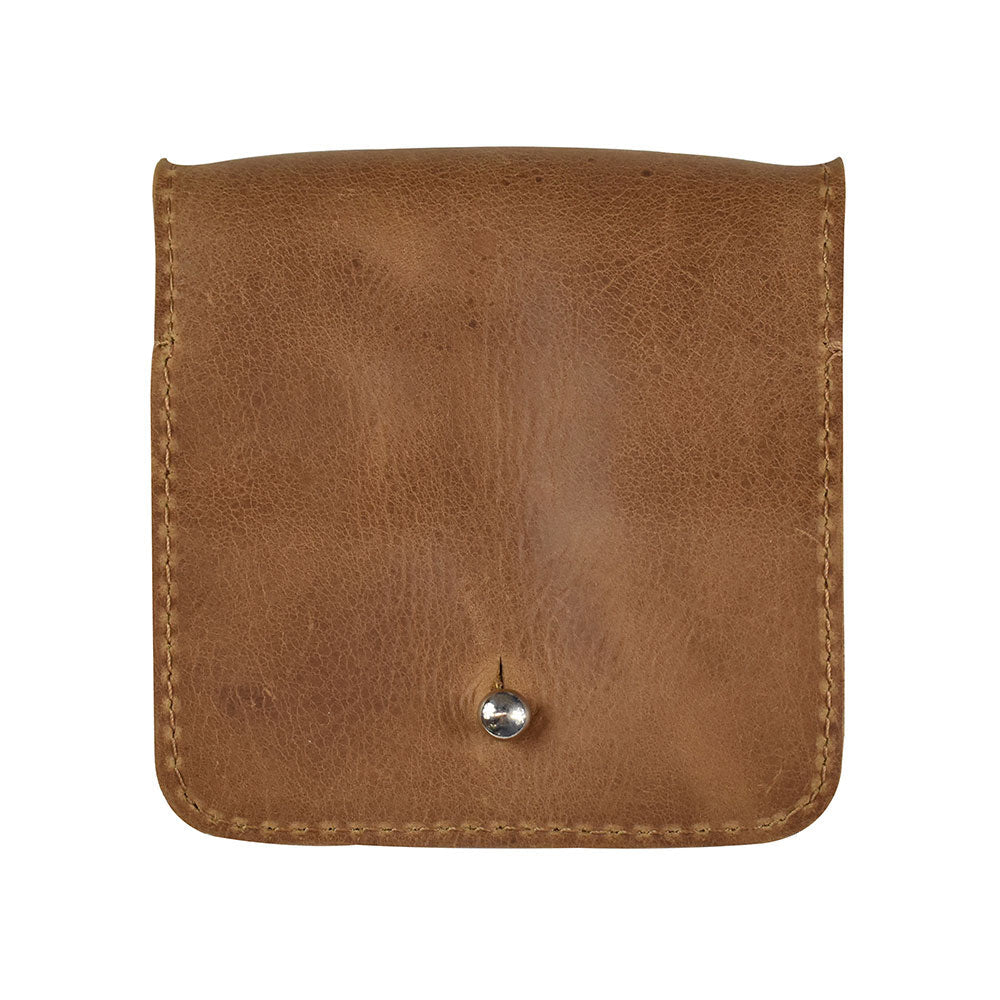 Exterior shot of a Hide & Drink Jewelry Pouch, showcasing its soft full grain leather finish. This small batch artisan piece excels as a stylish travel size box for rings and unique wedding gifts.