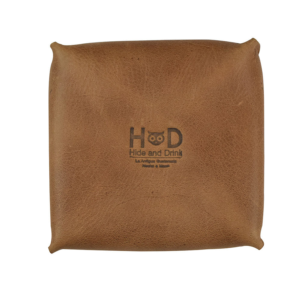 Front view of a Hide & Drink Jewelry Pouch depicting the quality of full grain leather. Perfect as a mini travel size box for rings, it offers chic storage and is an ideal choice for grooms and bridesmaids.