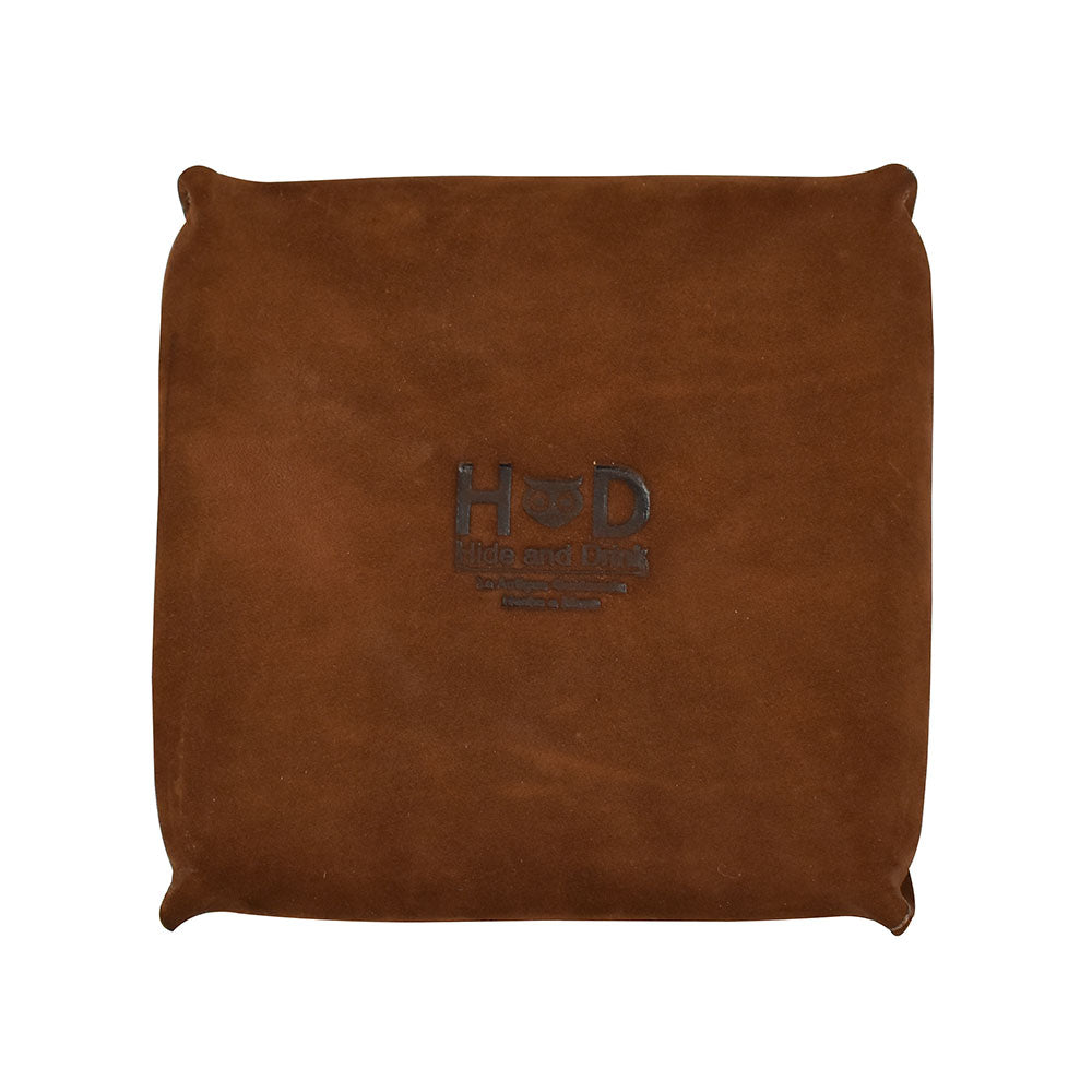 Front of a Hide & Drink Jewelry Pouch crafted from gorgeous full grain leather, ideal for organizing jewelry. This artisan gift represents exceptional hand cut quality, making it a great choice for bridesmaids and grooms.