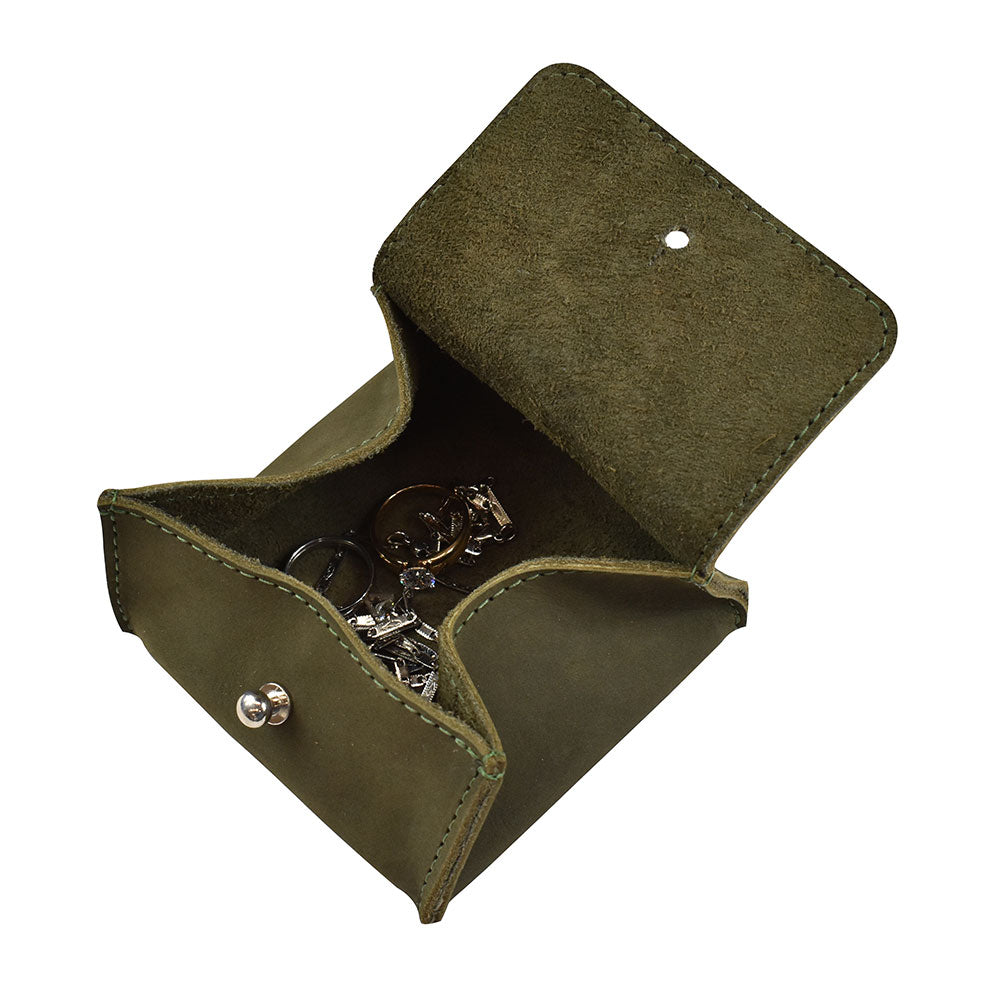 Interior view of a Hide & Drink Jewelry Pouch filled with rings, offering excellent organization for jewelry. This artisan-made pouch is a perfect wedding gift.
