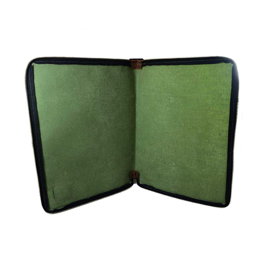 Inside view of the Waxed Canvas Zippered Journal Cover for Moleskine (Notebook NOT Included) by Hide & Drink with a green Canvas lining, showcasing its practicality as a Cahier Case. Handmade using Full Grain Leather, crafted with care in La Antigua Guatemala & Oaxaca Mexico.