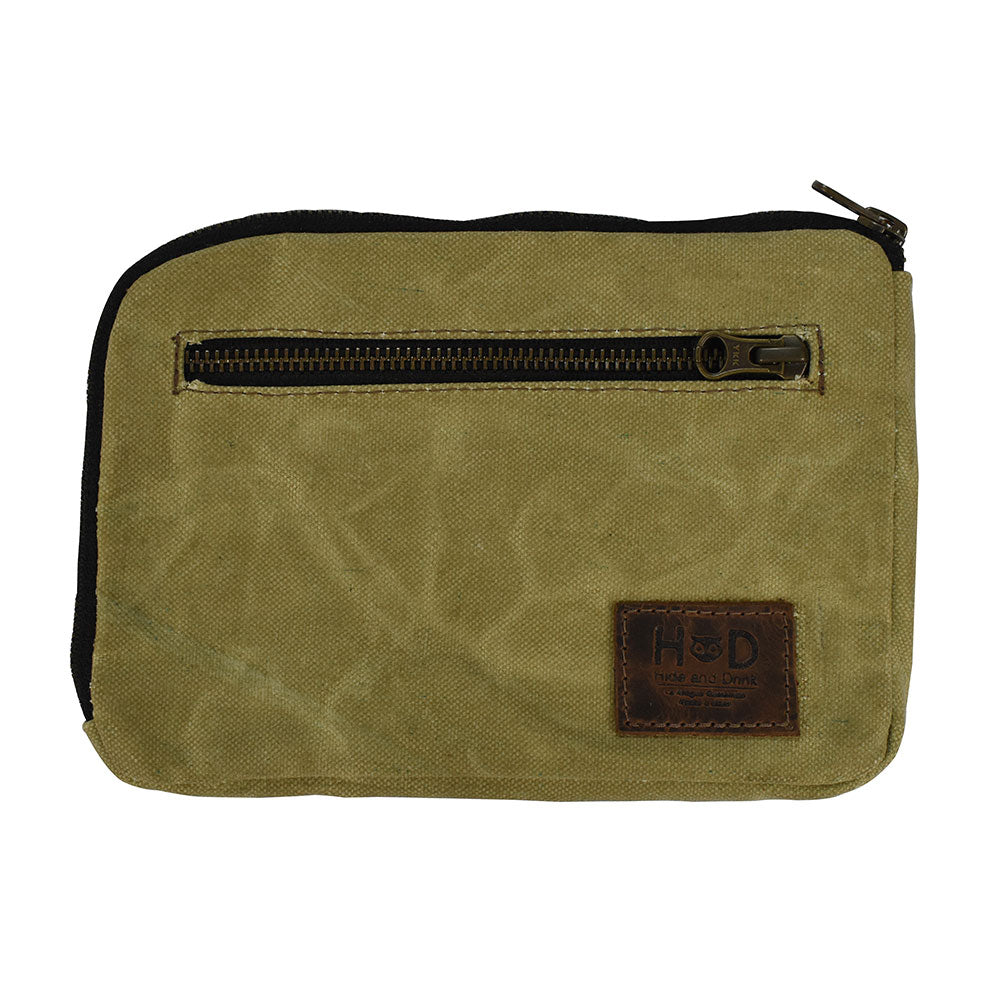 Hide & Drink's Zipper Gear Pouch made from water resistant waxed canvas, perfect for camping and travel. Features a sturdy zipper closure and artisan craftsmanship, handmade in La Antigua Guatemala.