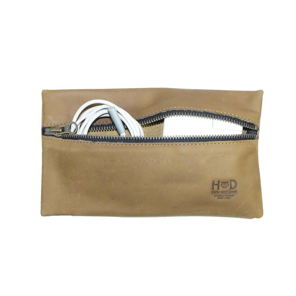 Hide & Drink Utility Cord Pouch in a light tan color, illustrating the perfect blend of elegance and utility. Ideal as an all-purpose utility & charger case for MacBook, iPad & Laptop, it acts as a superb cable organizer while reflecting artisan craftsmanship from La Antigua Guatemala & Oaxaca Mexico.