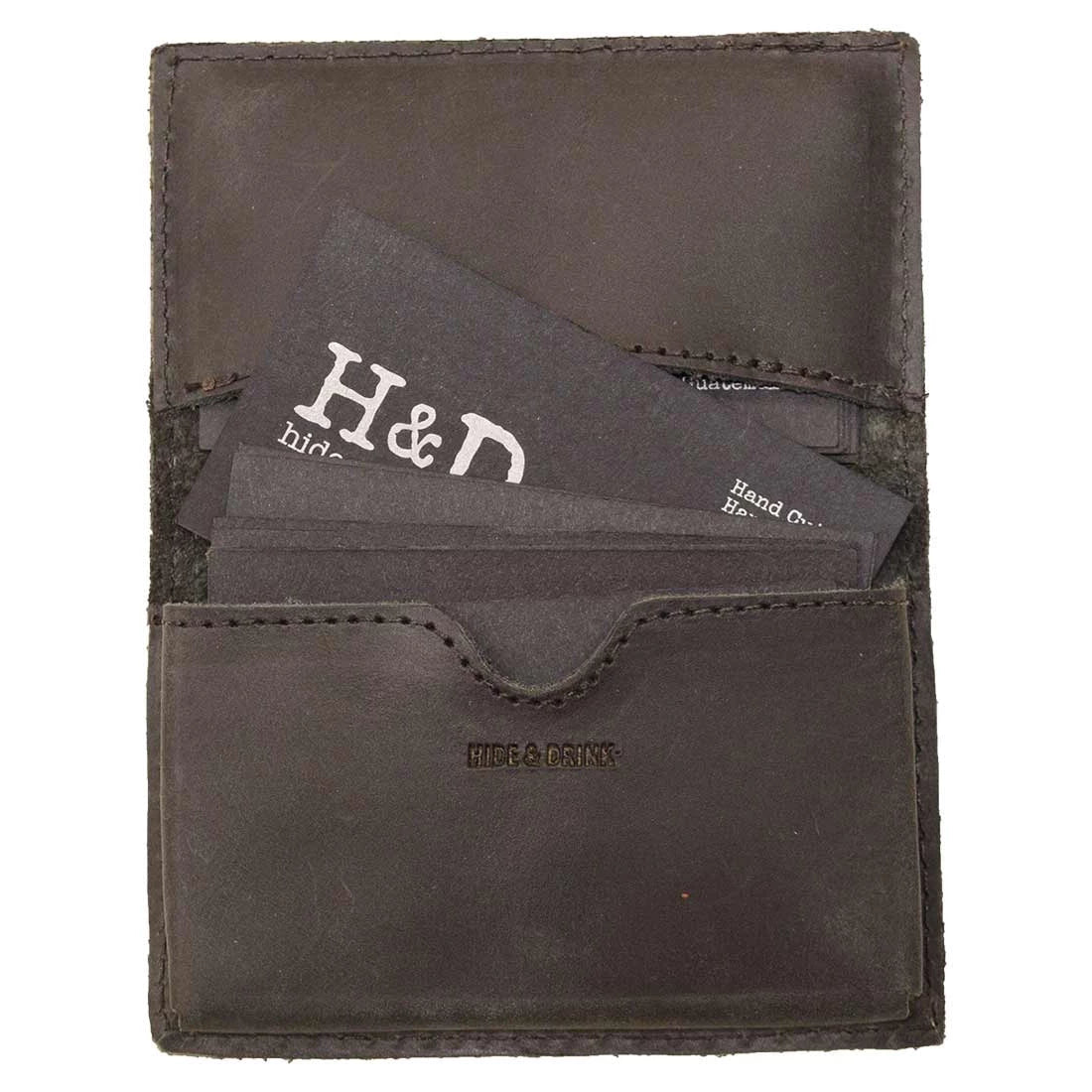 Hide & Drink's Vintage Card Holder featuring business cards, showcasing its practicality and stylish design. This full grain leather wallet serves as a cash organizer, reflecting the craftsmanship of small batch production in La Antigua Guatemala & Oaxaca Mexico.
