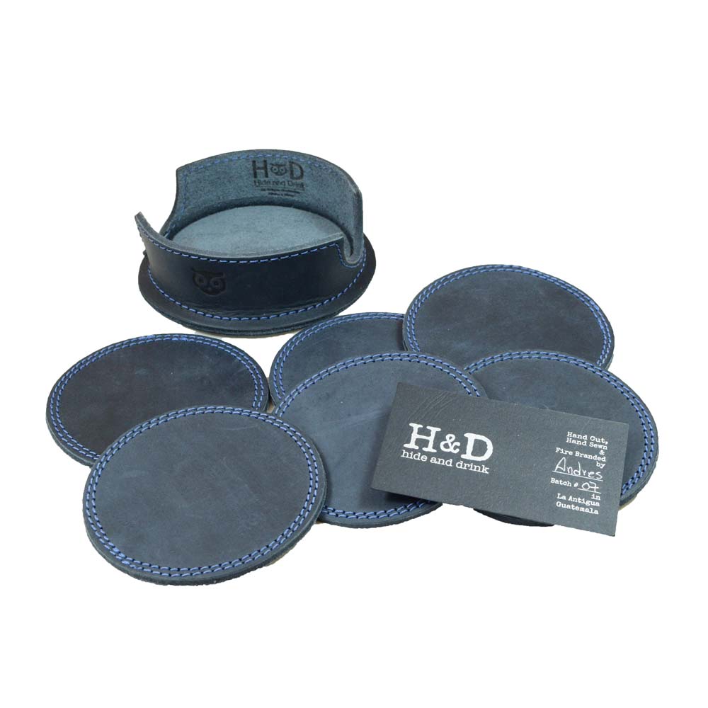 Thick Leather Coasters (6-Pack) by Hide & Drink alongside a product card, showcasing the artisan-coordinated circular coasters in blue slate leather. These coasters exemplify small batch production and are hand cut, hand sewn, and fire branded, proudly handmade in La Antigua Guatemala.