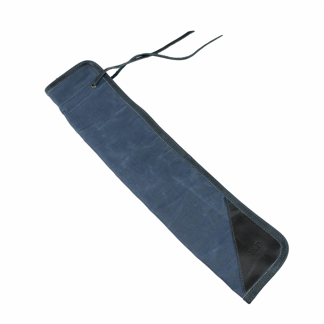 Close-up view of the blue Hide & Drink Drummstick Bag, focusing on its fine craftsmanship with Waxed Canvas & Full Grain Leather. This elegant Drumstick Bag Holder provides style and durability, embodying the artisan skills of small batch production from La Antigua Guatemala & Oaxaca Mexico.