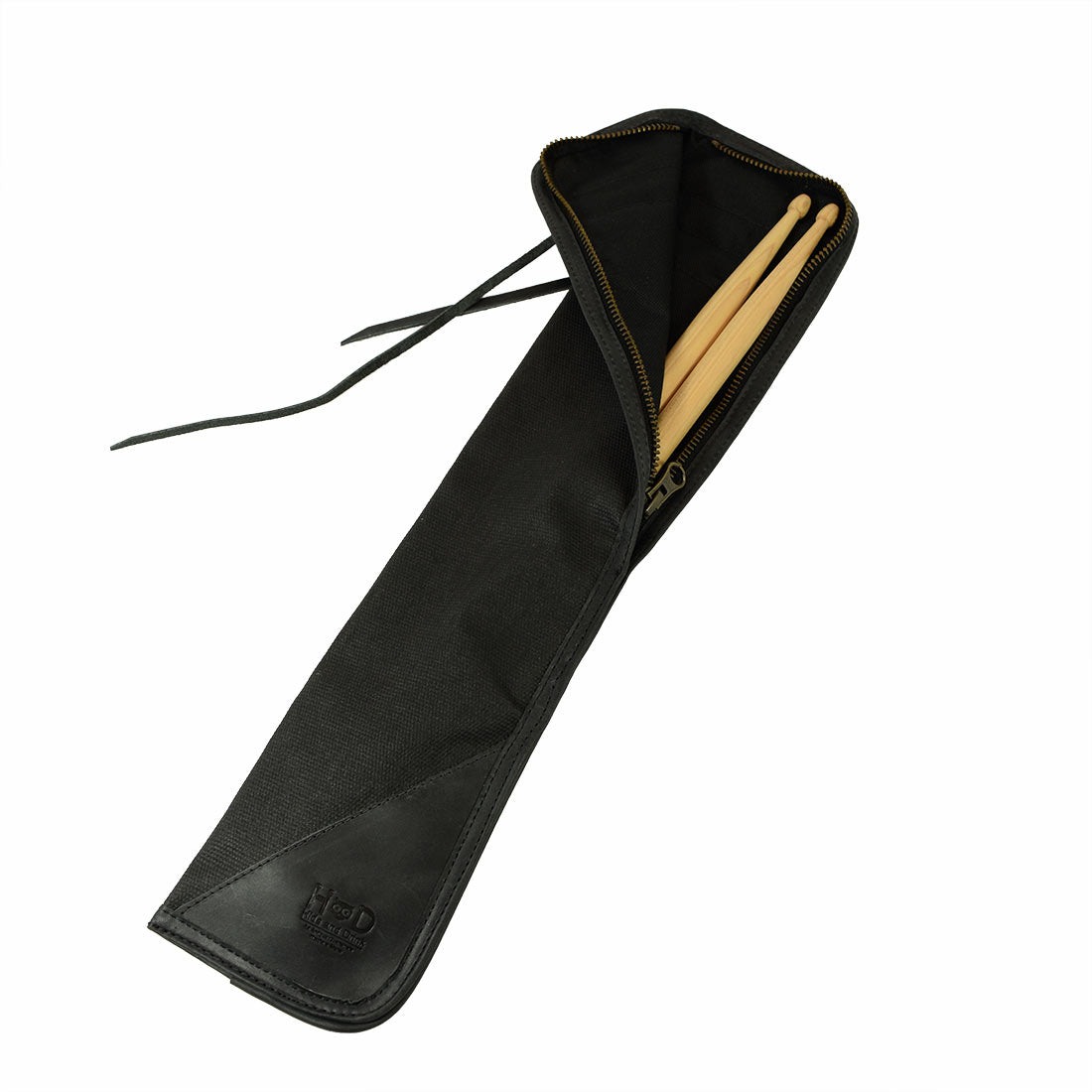 Open view of the black Hide & Drink Drummstick Bag showing drumsticks inside, crafted from durable Waxed Canvas & Full Grain Leather. This essential Drumstick Bag Holder combines style and functionality, exemplifying StockyardX's commitment to small batch production from La Antigua Guatemala & Oaxaca Mexico.
