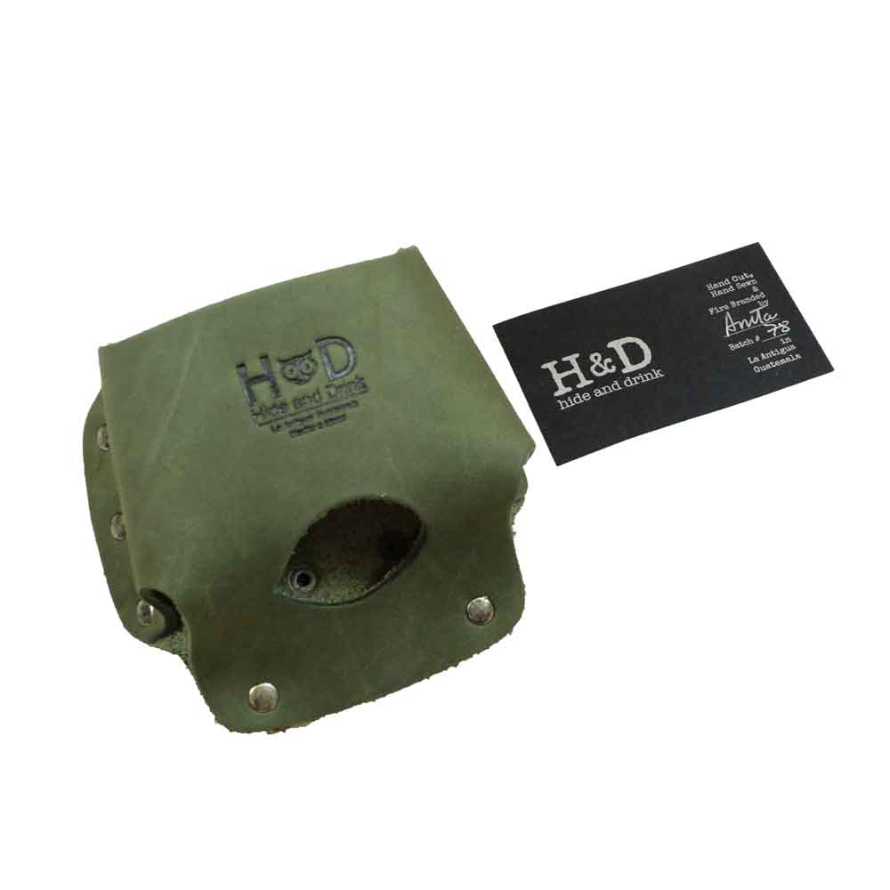 Hide & Drink's Large Tape Holster displayed with its useful branding card, highlighting its artisan quality. A durable, handmade solution for holding Large Tape Measures securely.