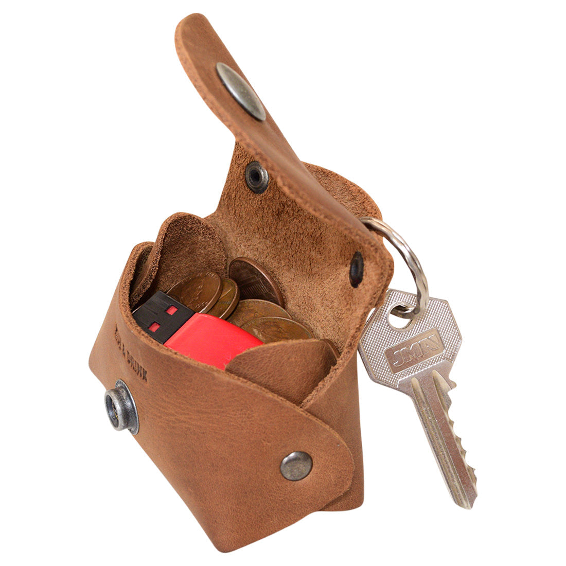 Inside view of the Tiny Handbag Keychain in light brown leather, featuring its spacious design with key ring holder by Hide & Drink. This versatile Tiny Handbag with Key Ring Holder is crafted from full grain leather and reflects small batch production, hand cut, hand sewn, and fire branded artistry, expertly handmade in La Antigua Guatemala & Oaxaca Mexico.