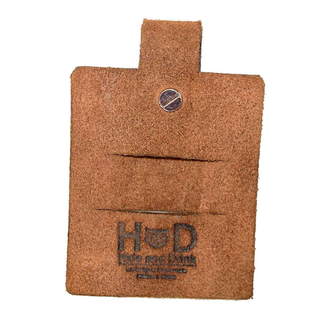 Hide & Drink's Cable Holder featuring thick full grain leather, perfect for managing wired headphones and phone chargers. This artisan-made accessory, hand cut and sewn with a fire branded finish, embodies the craftsmanship of small batch production from La Antigua Guatemala & Oaxaca Mexico.