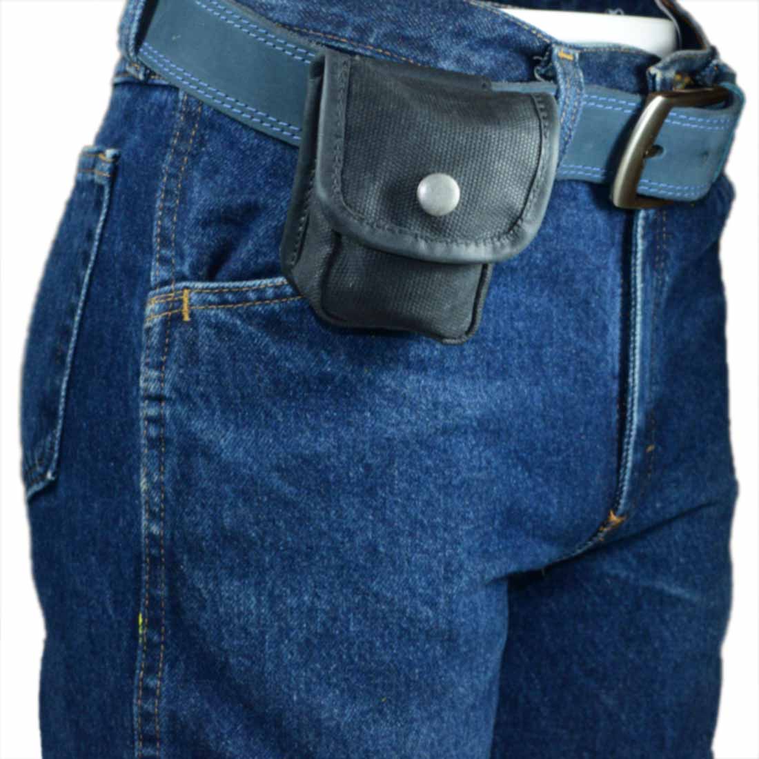 Hide & Drink's Mini Belt Pouch in action, highlighting its placement on a belt for easy accessibility. This utility pouch is ideal for camping and outdoor adventures, constructed from water-resistant waxed canvas, showcasing stockyardX's artisan craftsmanship with hand-cut and hand-sewn details, proudly made in La Antigua Guatemala & Oaxaca Mexico.