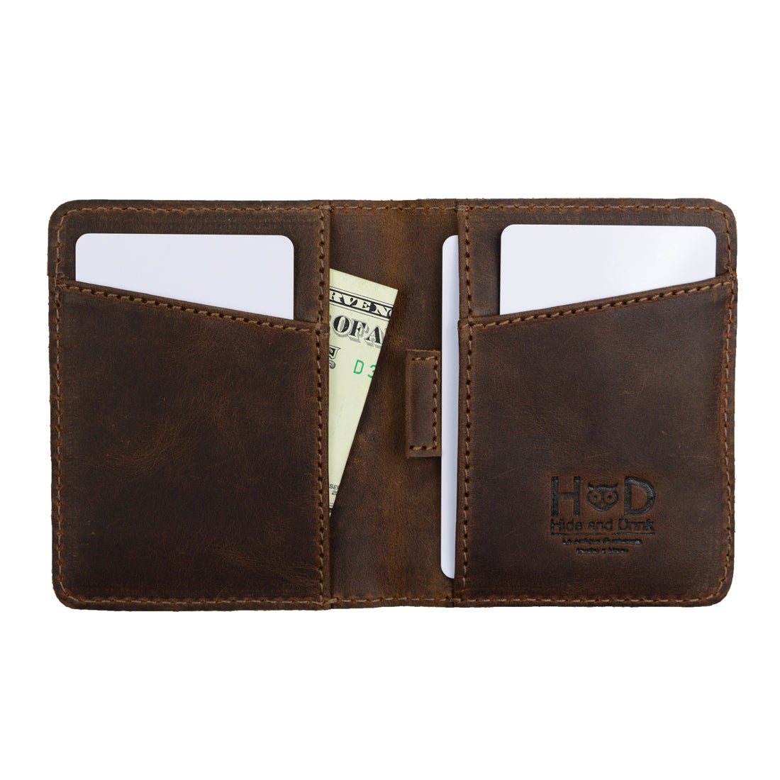 Interior layout of Hide & Drink's Minimalist Bi-fold Wallet displaying slots for cards and a space for cash. Crafted from durable full grain leather, this everyday accessory holds up to 6 cards plus folded bills, emphasizing handmade quality, fire branding, and the artisan touch typical of small batch production.