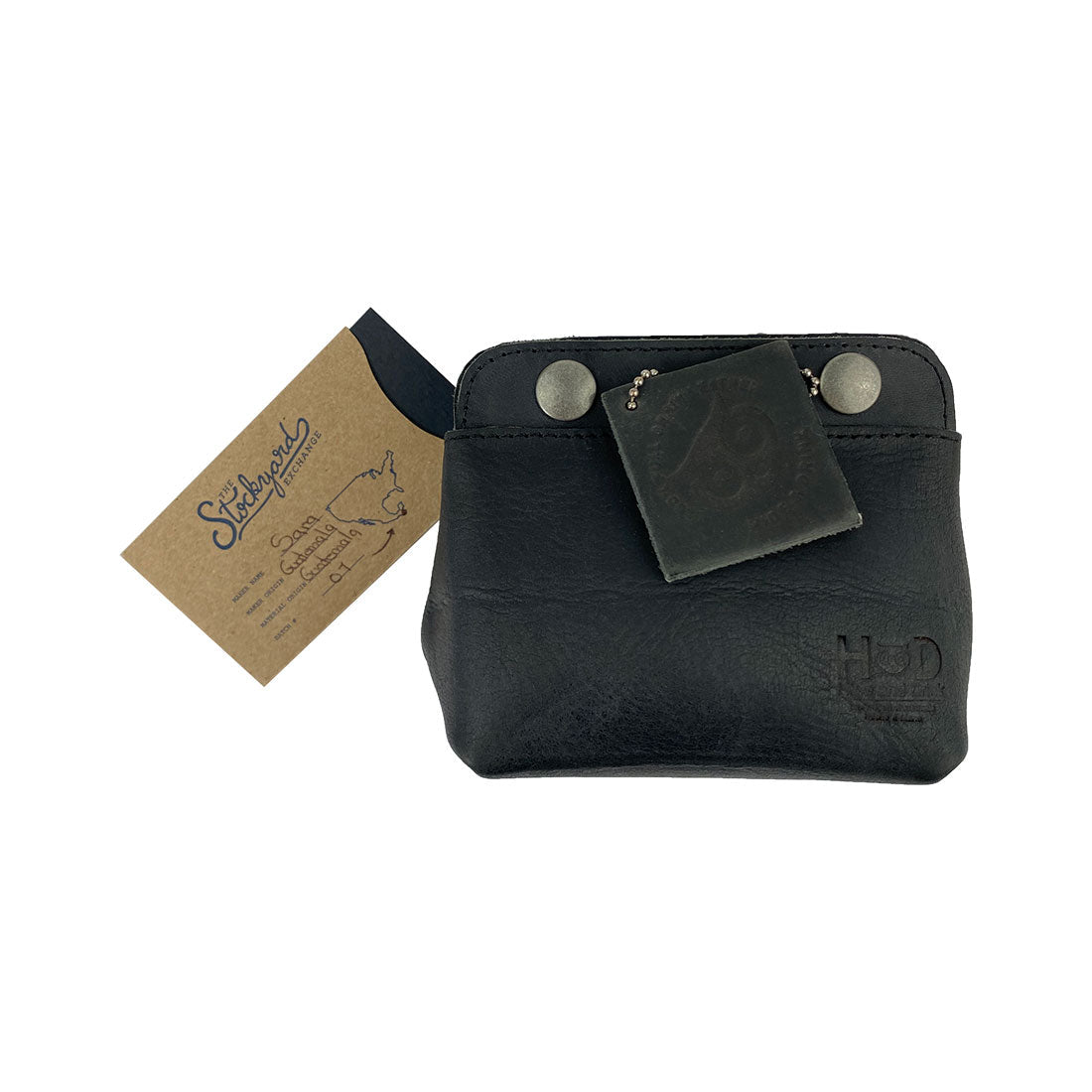 Tag featuring Hide & Drink Double Snap Pouch, highlighting its multi-functional design for cash, coins, and small items. This artisan-crafted full grain leather item is made in La Antigua Guatemala.