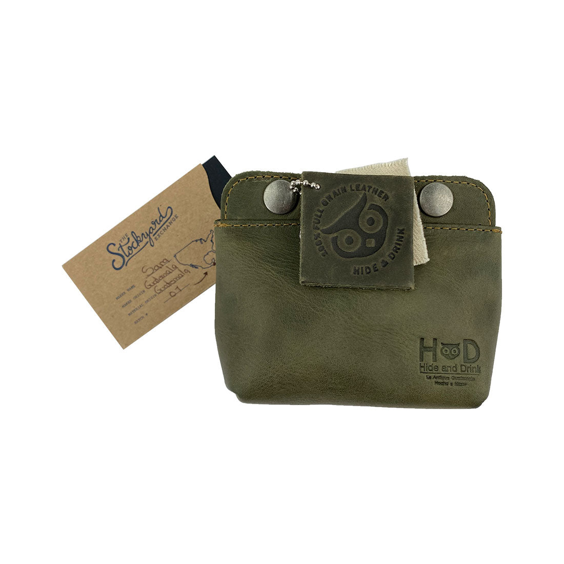 Tag featuring Hide & Drink Double Snap Pouch highlighting its artisanal craftsmanship. This full grain leather pouch serves as a stylish cash holder and coin purse from La Antigua Guatemala.
