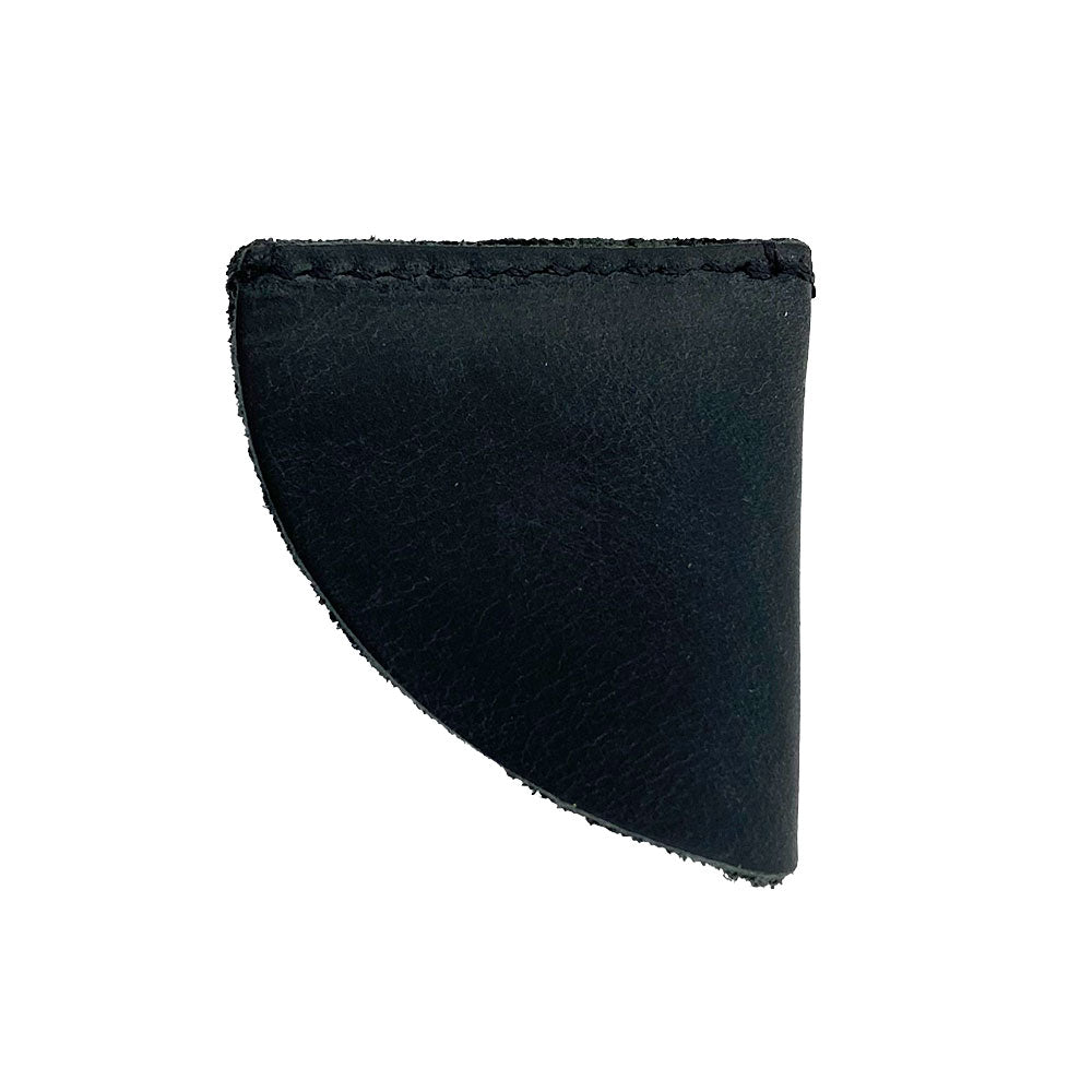 Stylish black leather corner bookmark from Hide & Drink, part of the Corner Bookmark 3-Pack, exhibiting a clean design. This functional book accessory is made of full grain leather, emphasizing artisan craftsmanship through small batch production, hand cut and hand sewn, showcasing quality from La Antigua Guatemala & Oaxaca Mexico.