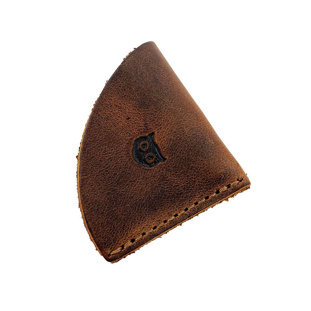 Chic corner bookmark from Hide & Drink, included in the Corner Bookmark 3-Pack, demonstrating a sleek leather design with an owl motif. This bookmark is made from full grain leather, perfect for keeping your place in style while showcasing artisan craftsmanship from La Antigua Guatemala & Oaxaca Mexico, featuring hand cut and hand sewn details.
