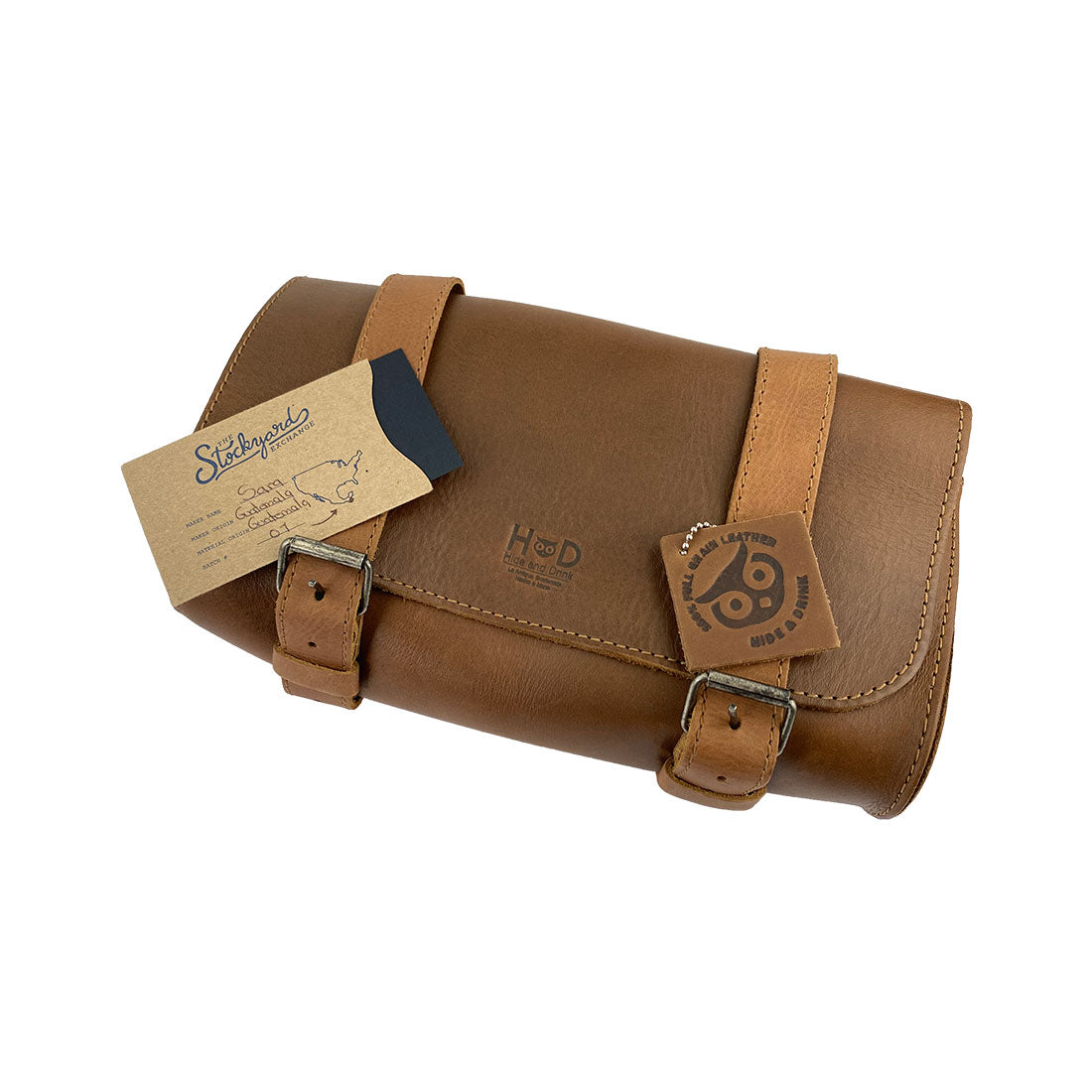 Hide & Drink Leather Motorcycle Tool Bag showcasing its beautiful form made from high-quality Full Grain Leather, ideal for motorcyclists in need of a stylish Biker Bag for Tools and Essentials. This smart Handlebar Bag with Adjustable Straps also acts as a great Tool Organizer, illustrating the handmade craftsmanship of La Antigua Guatemala & Oaxaca Mexico.