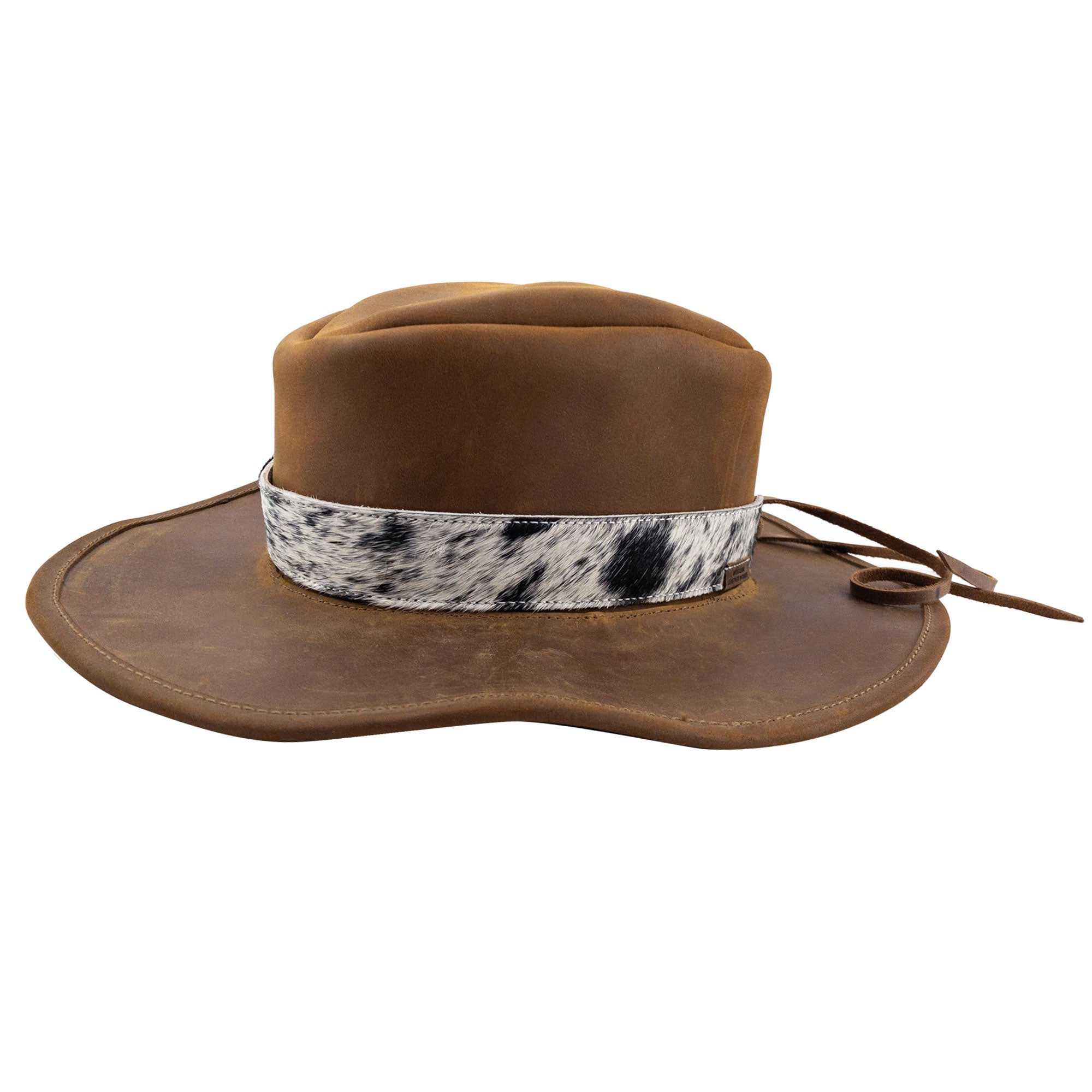 Stylish Cowboy Hat with a Hair-On-Hide Full Grain Leather band from Western Leather Works. Perfect for those who love rodeo style, this hat is an adjustable accessory handcrafted in La Antigua Guatemala, showcasing the durability and artistry of small batch production with hand cut, hand sewn, and fire branded details.