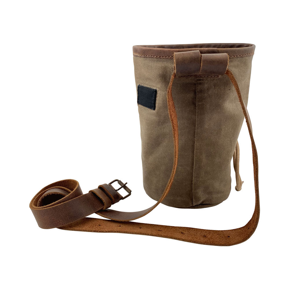 Hide & Drink Chalk Bag showcasing a durable design with Waxed Canvas and a convenient strap. Perfect for rock climbing and gymnastics, this bag features a zippered pocket and is made from Full Grain Leather by artisans in La Antigua Guatemala & Oaxaca Mexico.