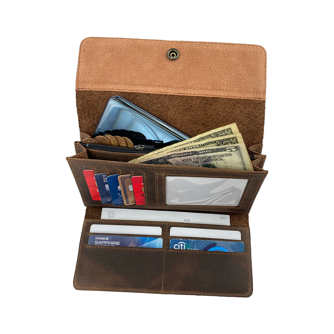 Inside compartments of Heather's Tri Fold Folio Wallet, showing easy access to cards and cash. This Tri Fold Folio Wallet is an ideal minimalist card saver for women, beautifully crafted from full grain leather and featuring a unique button closure, handmade in La Antigua Guatemala & Oaxaca Mexico.