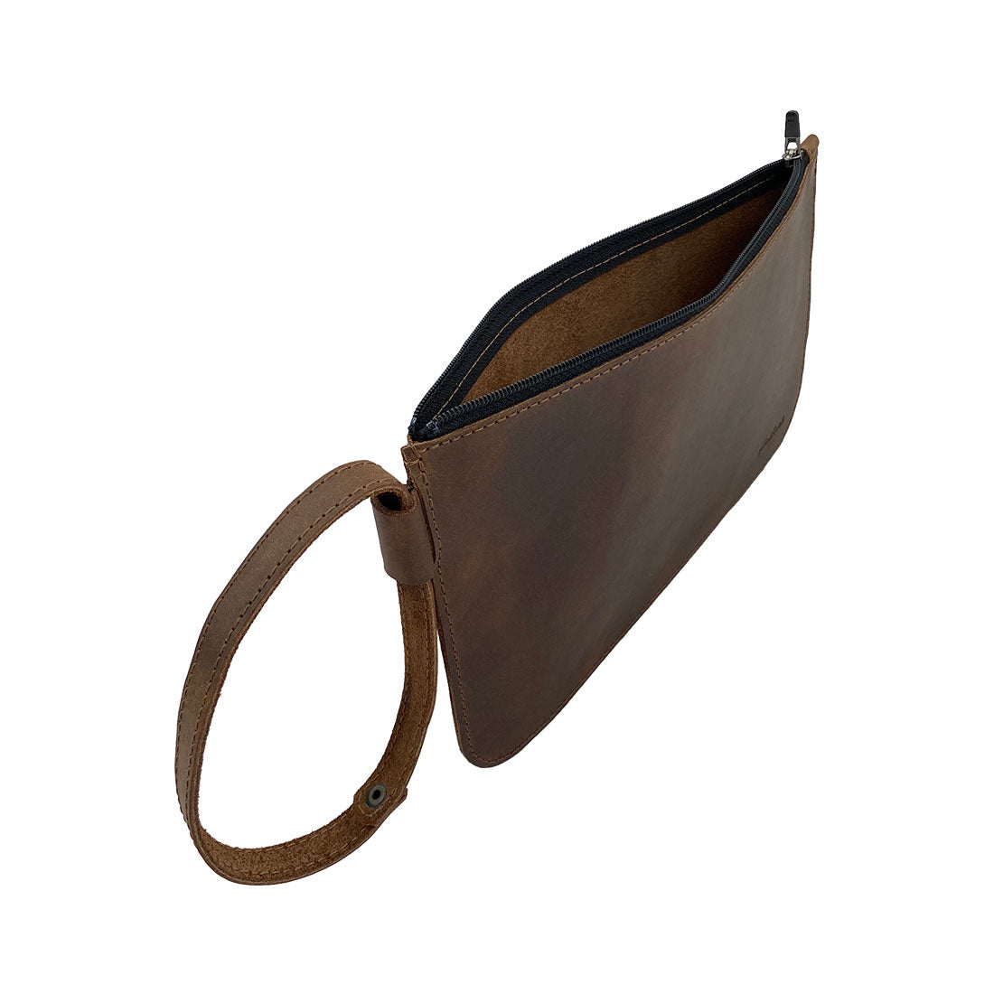 Side angle of Heather's Rustic Clutch Bag, demonstrating its spacious interior and practical zipper closure. This stylish pouch is ideal for organizing small valuables like makeup or cosmetics. Made from high-quality full grain leather, it's a testament to artisan craftsmanship, featuring hand cut and hand sewn details, fire branded for authenticity, from La Antigua Guatemala & Oaxaca Mexico.