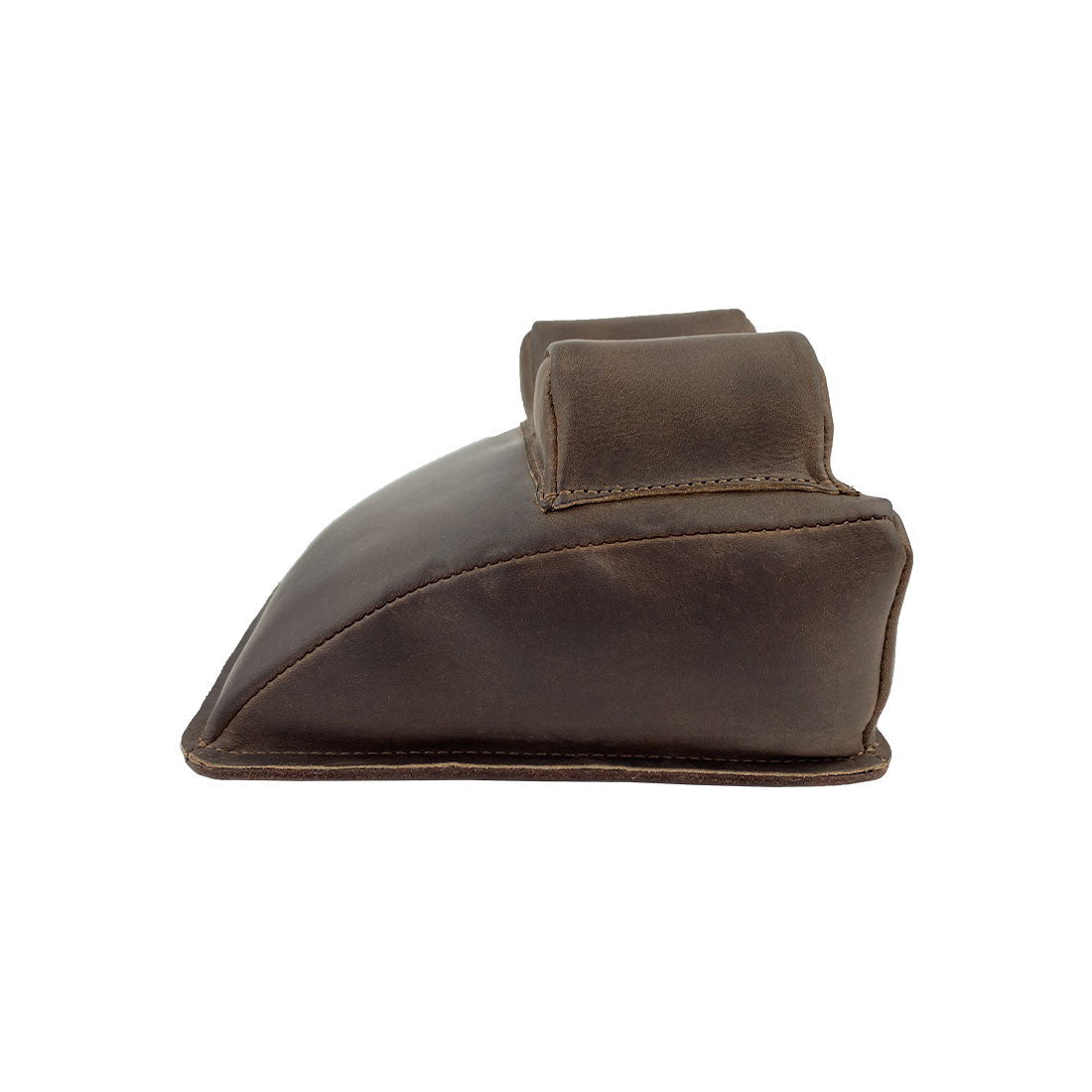 Hide & Drink Guitar Neck Rest side view showcasing its ergonomic design for string instrument maintenance. Constructed from premium full grain leather, this handy tool aids in string changing, repair, and cleaning care for guitars, banjos, and mandolins, embodying small batch artisan craftsmanship from La Antigua Guatemala & Oaxaca Mexico.