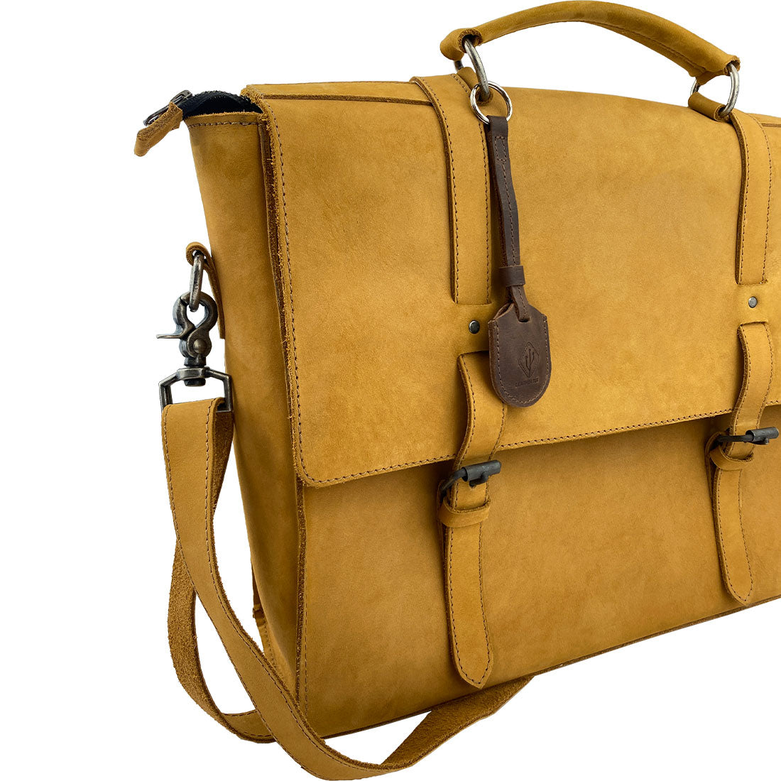 LeatherTex Rustic Strap Keyring for AirTag, displayed on a stylish messenger bag, emphasizing its function as a keychain holder for car and home. This full grain leather key organizer accessory is handcrafted with care in La Antigua Guatemala.