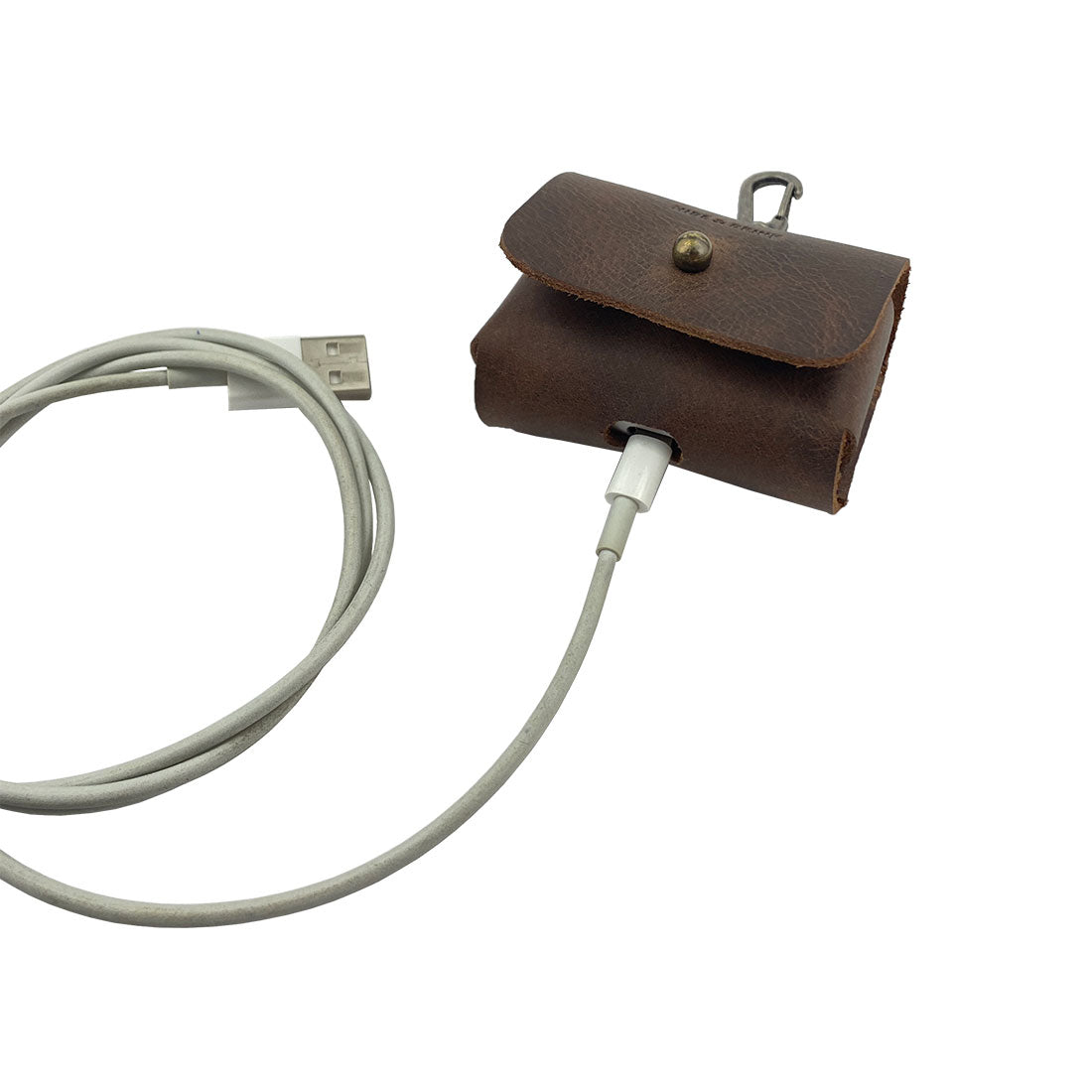 Airpods Pro Case Keychain by Hide & Drink - Featuring a USB charging connection option, this stylish leather case is both functional and protective. Ideal for travel or everyday use, it showcases full grain leather craftsmanship, handmade in La Antigua Guatemala & Oaxaca Mexico.
