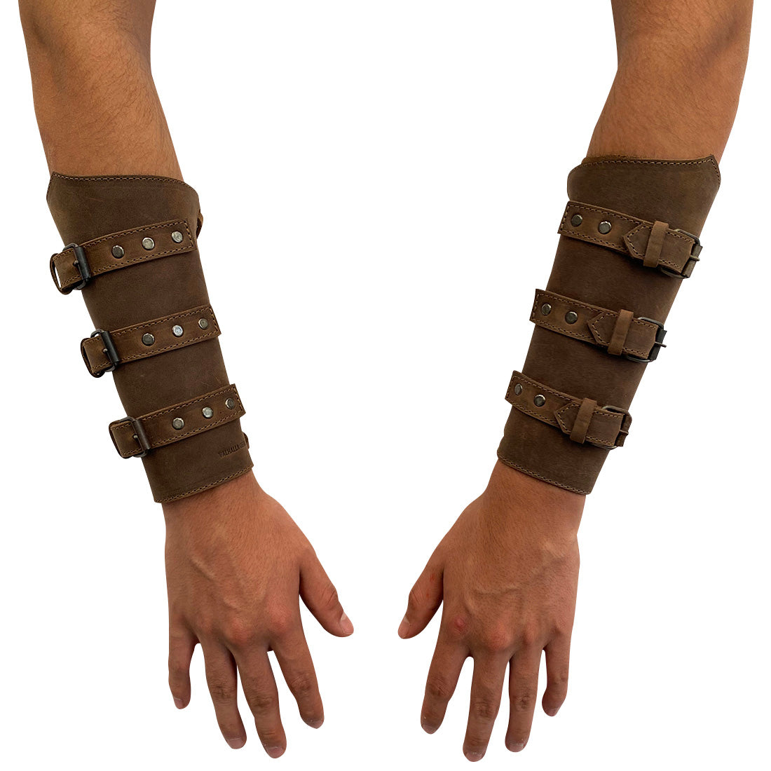 Pair of Valhalla Gear Set of 2 Archery Buckle Bracer displayed on both hands, emphasizing the adjustable nature and full grain leather construction. These wrist guards are excellent hand protectors for bow shooting practice, showcasing handmade craftsmanship from La Antigua Guatemala & Oaxaca Mexico.