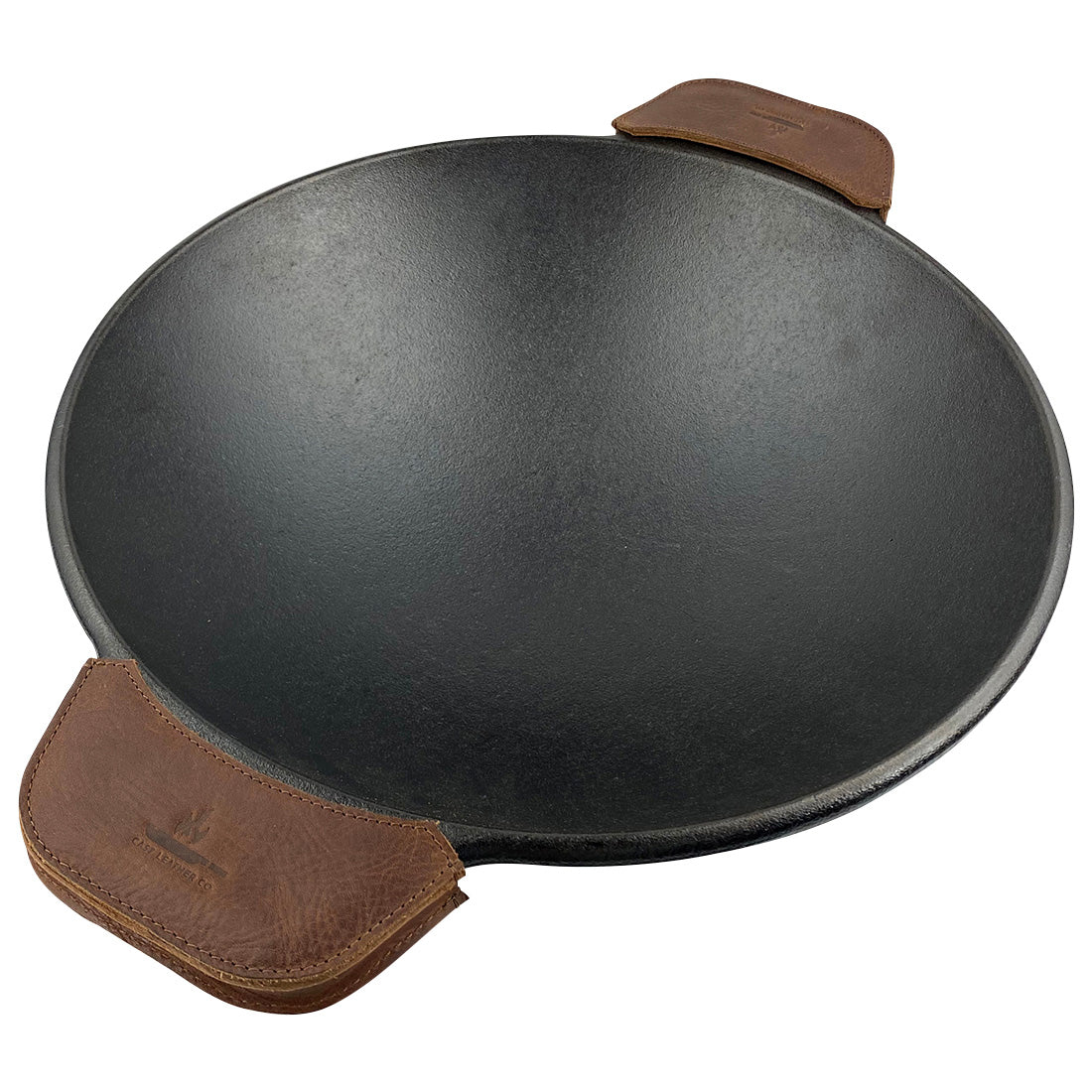 Wok prepared with leather handle covers, the Wok Sidekick from Cast Leather Co. provides both safety and style in the kitchen. These full grain leather handle covers are handmade in La Antigua Guatemala & Oaxaca Mexico, reflecting a rustic charm and artisan craftsmanship.