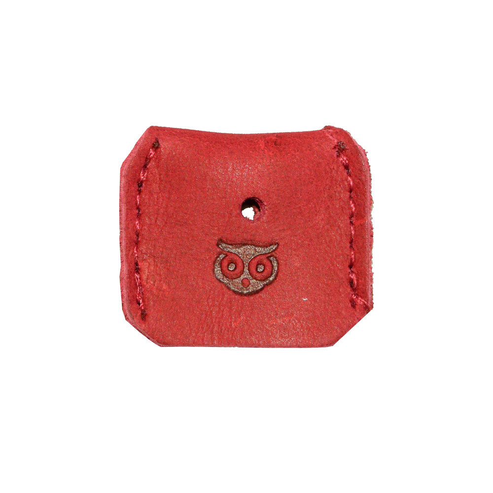 Highlighting a red Key Cover from Hide & Drink, showcasing exquisite craftsmanship. This artisan key sleeve is part of a set of 5 key protectors made from full grain leather, representing the quality of small batch production and the beauty of hand cut, hand sewn detailing, made in La Antigua Guatemala & Oaxaca Mexico.