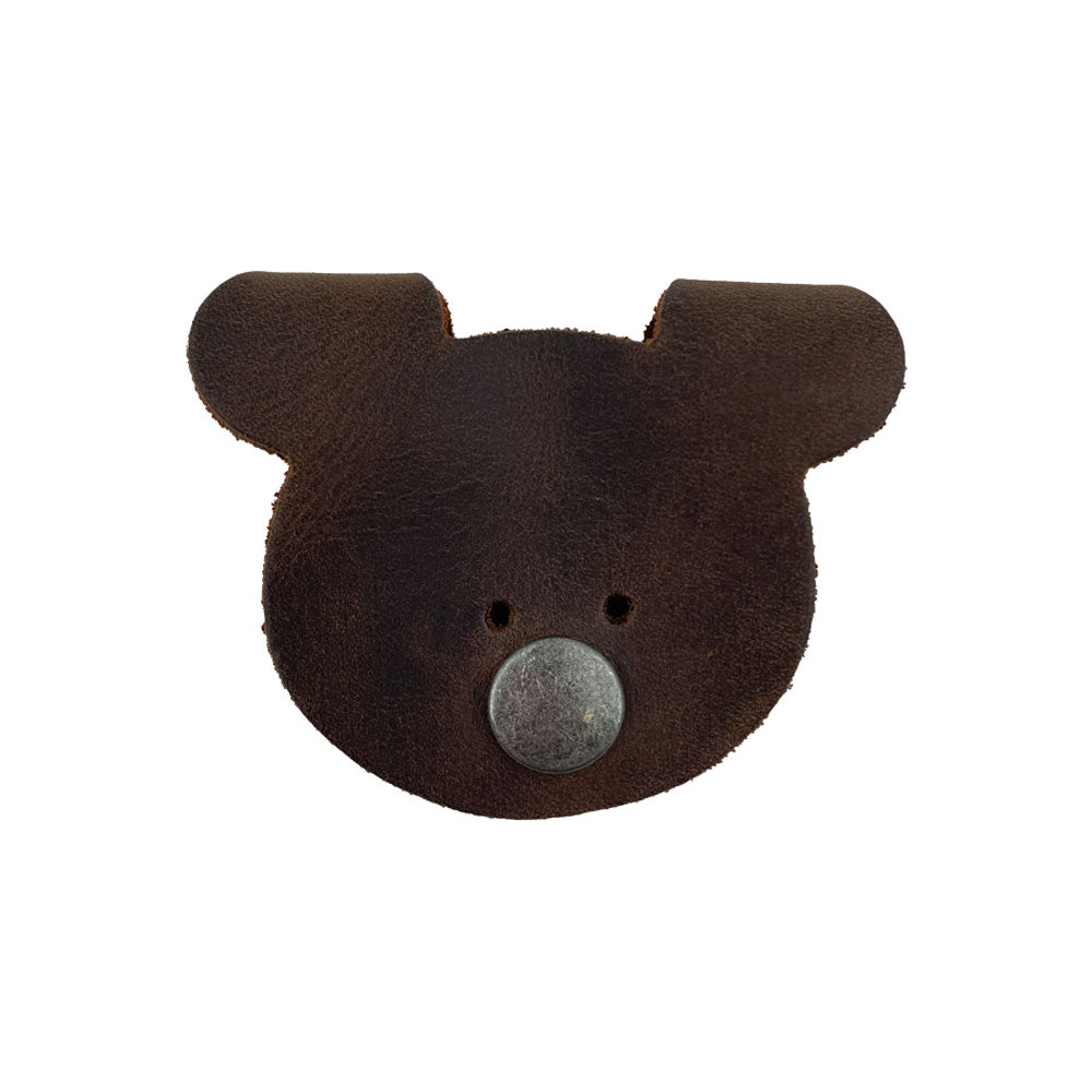 Top view of a Bear Shaped Cord Keeper (Cord Clam) by Hide & Drink, made from high-quality Full Grain Leather with a unique design, emphasizing artisan quality. Handmade in La Antigua Guatemala & Oaxaca Mexico, highlighting small batch production.