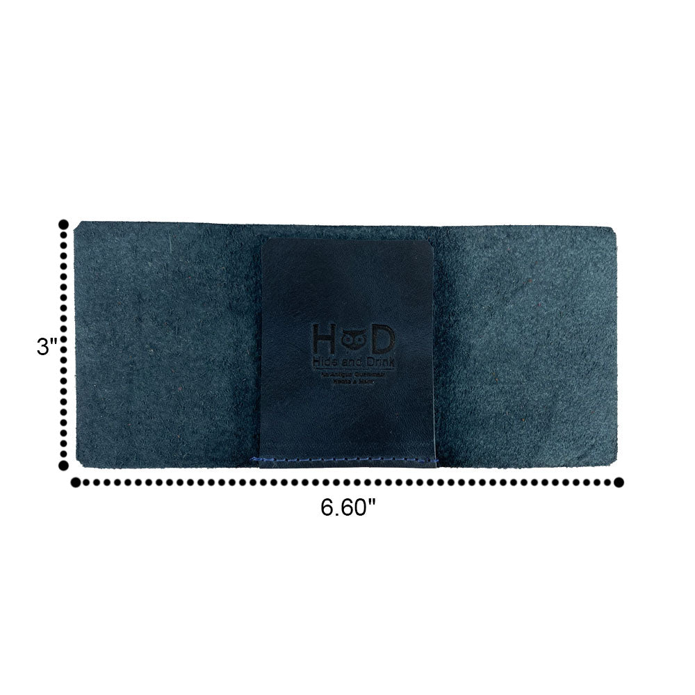 A close-up of the Hide & Drink Minimalist Wallet Bills Only showcasing its leather texture and craftsmanship. This Ultra Minimalist Wallet is a great cash organizer made from Full Grain Leather, emphasizing the hand cut details by artisans from La Antigua Guatemala.